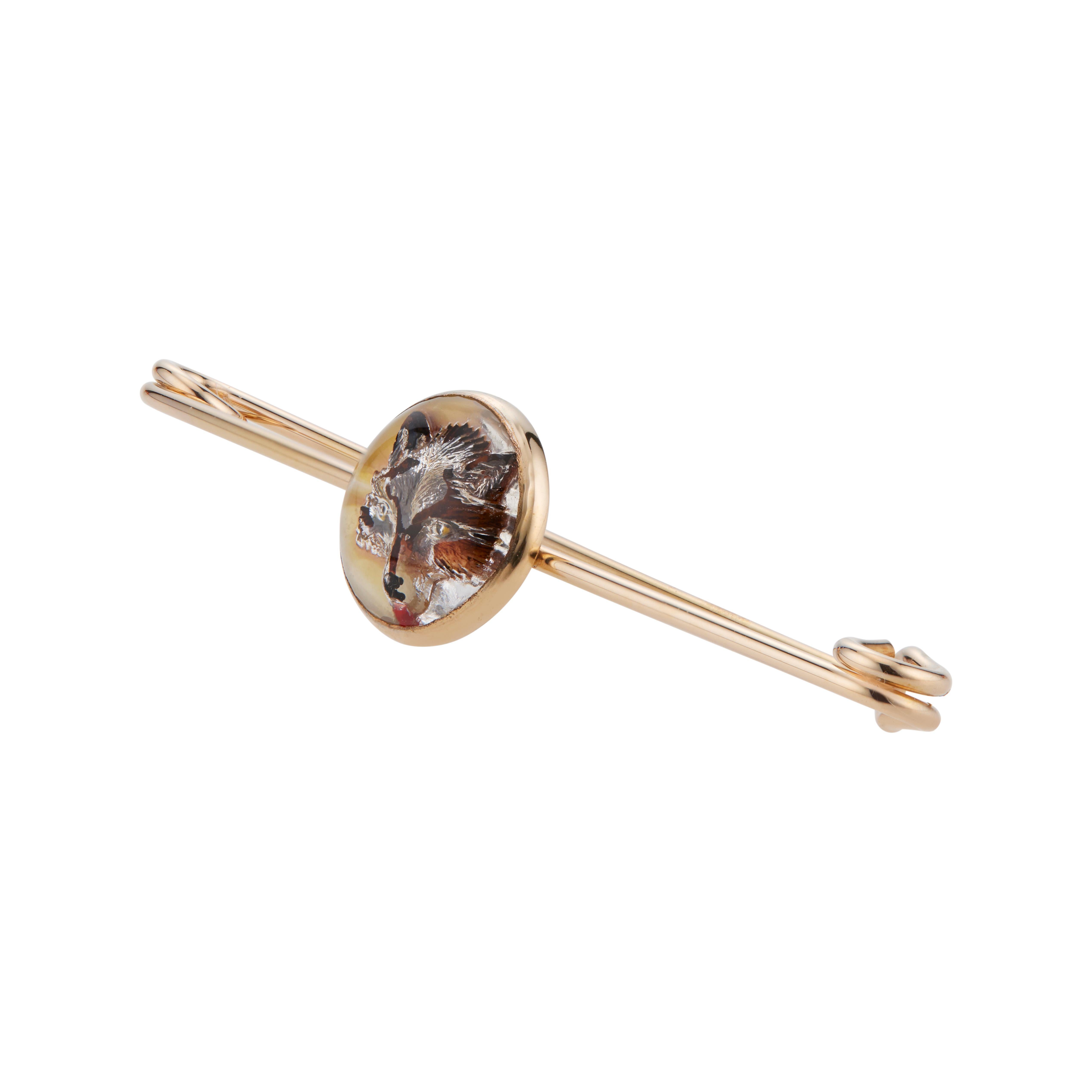 1930's Hand carved quartz crystal fox face brooch in 14k yellow gold. 

1 round cabochon crystal 
14k yellow gold 
Hallmark: correct Quality
3.4 grams
Top to bottom: 13.7mm or .5 Inches
Width: 63.7mm or 2.5 Inches
Depth or thickness: 5.7mm
