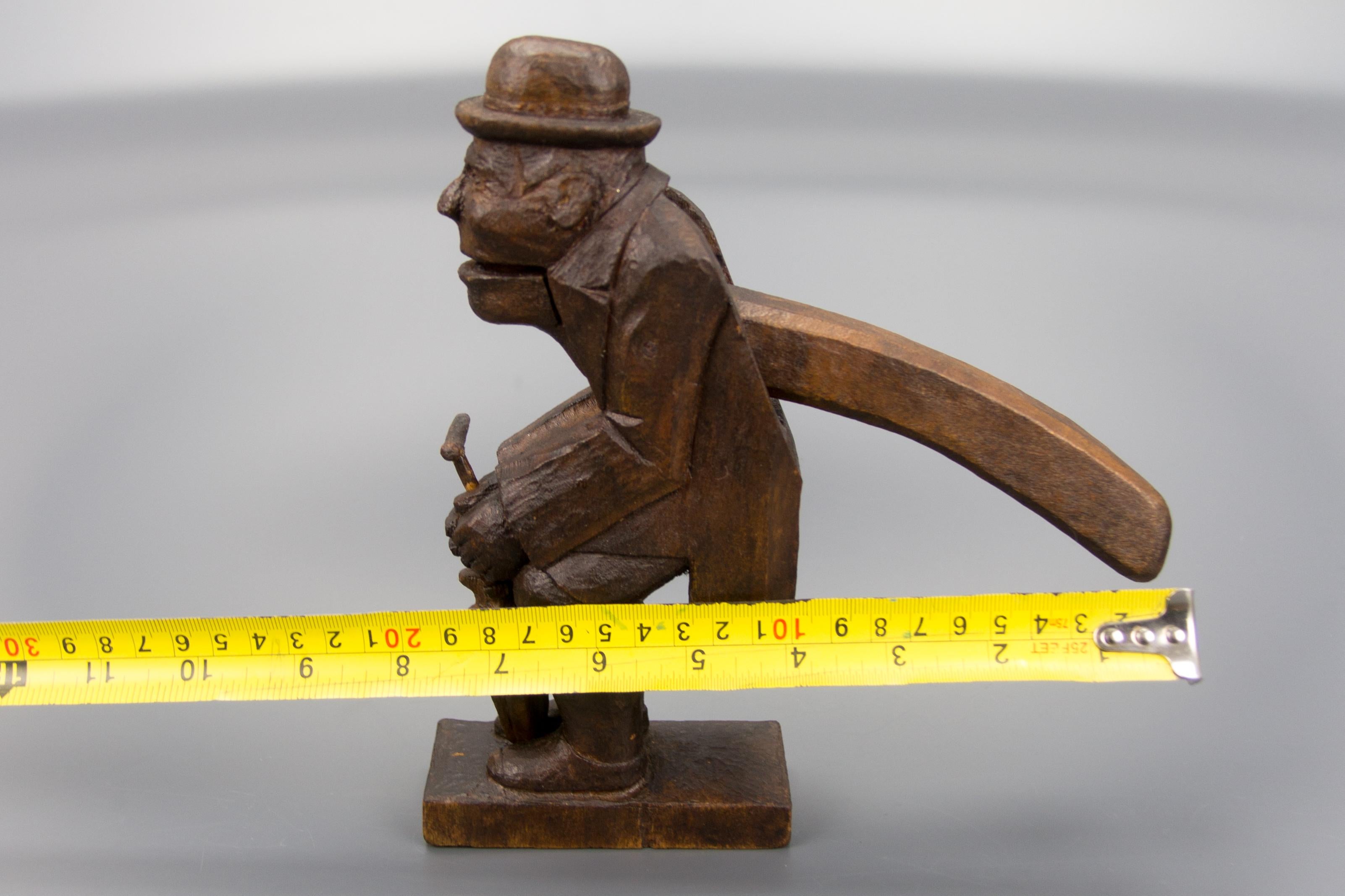 Hand Carved Dark Brown Wooden Figural Nutcracker of a Man, Germany, 1930s For Sale 9