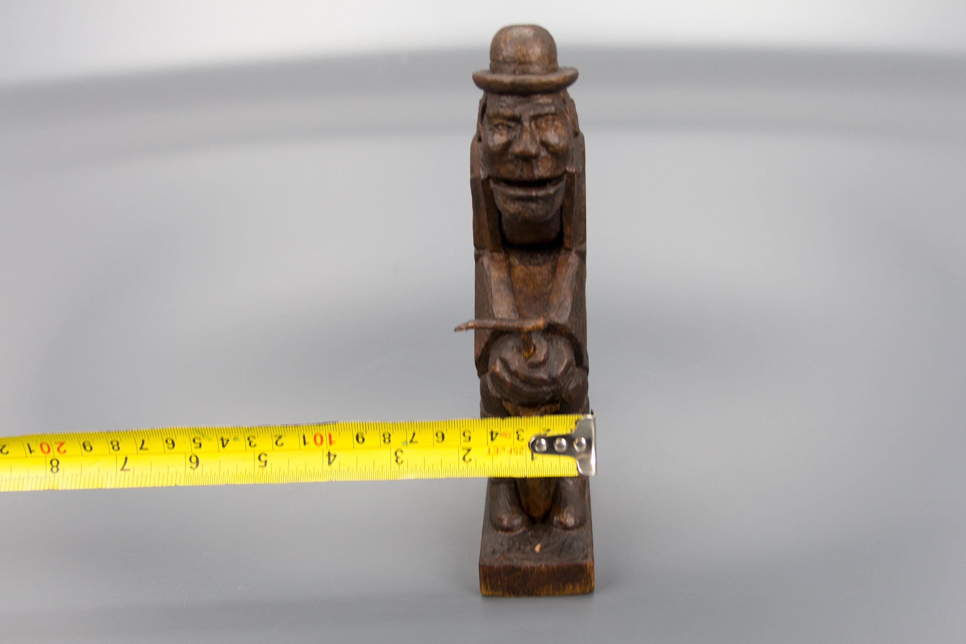 Hand Carved Dark Brown Wooden Figural Nutcracker of a Man, Germany, 1930s For Sale 10