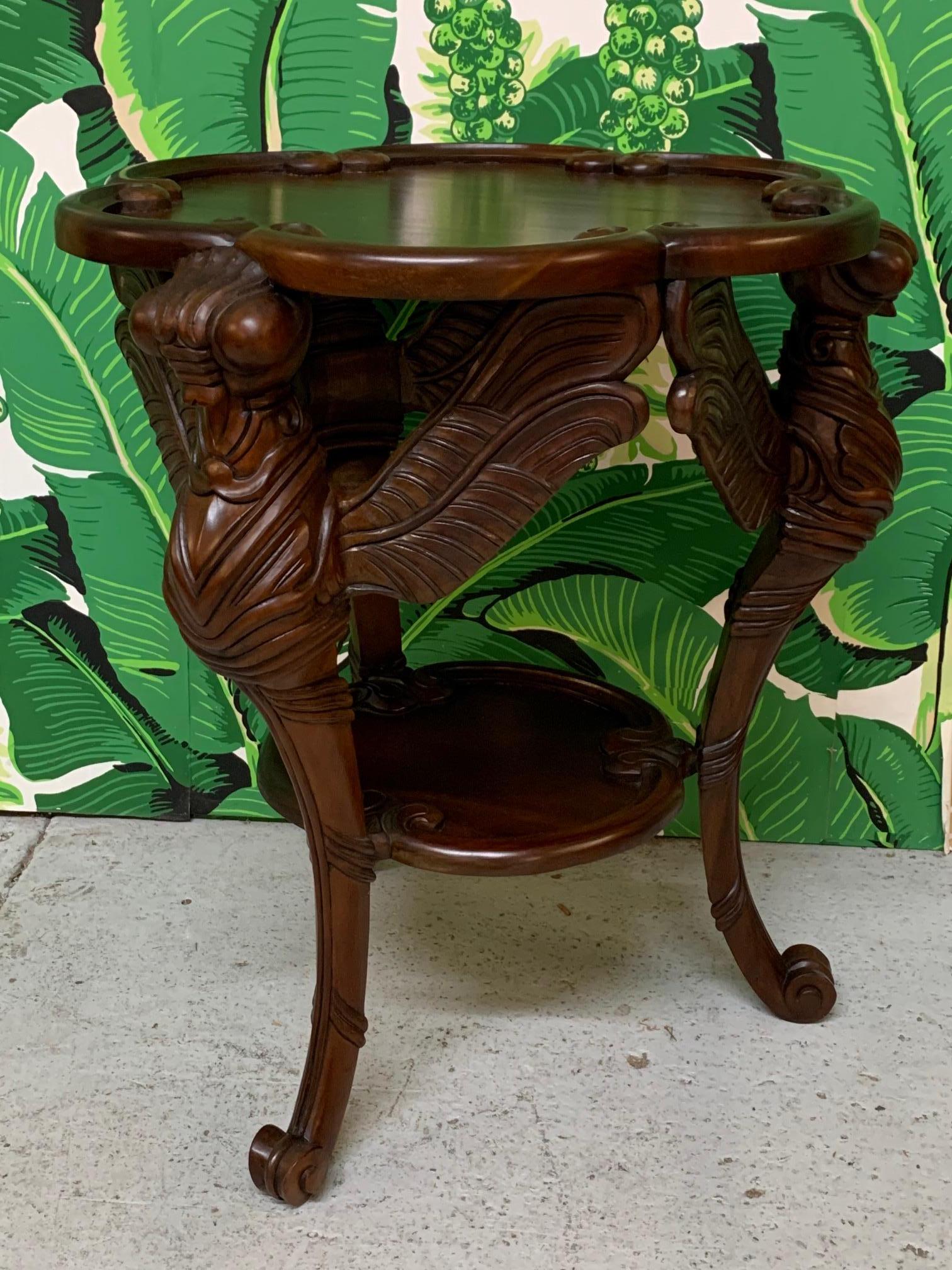 Unique end table features hand carved dragonfly sculptures as legs. Rich, dark finish. Condition is almost like new.