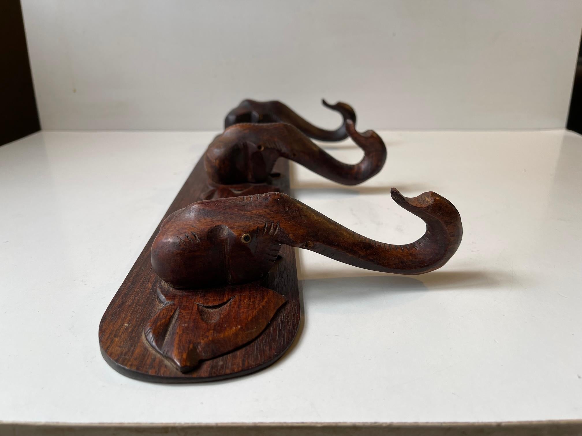 Mid-20th Century Hand-Carved Elephant Coat or Towel Rack in Dark Wood, 1930s For Sale