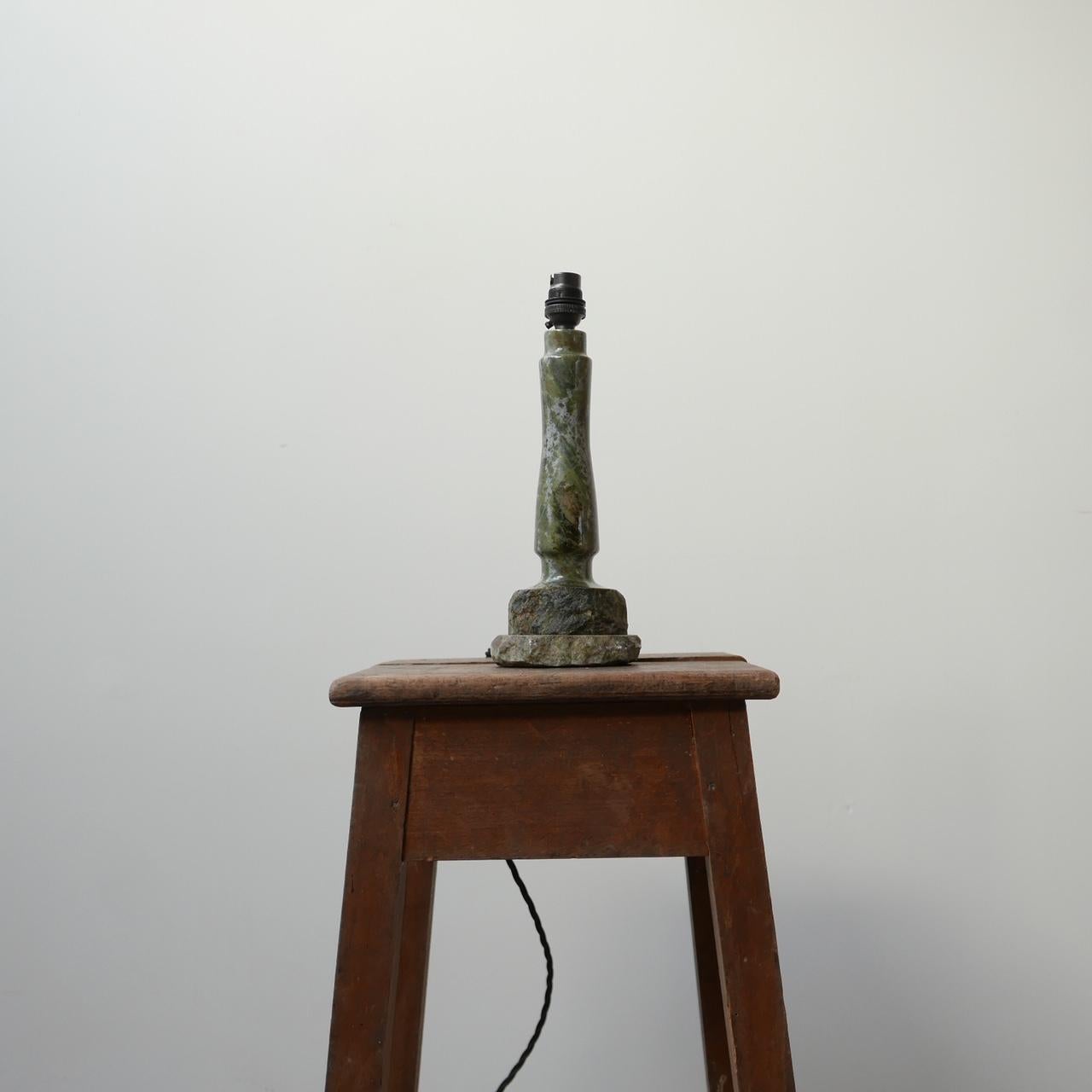 A cornish stone table lamp.

Likely carved in the form of a lighthouse.

Cornwall, England, mid to late 20th century.

Re-wired with black silk flex.

A similar lamp is available separately at the time of listing.

Dimensions: 11 W x 9 D x