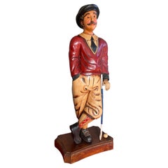 Escultura de suelo tallada a mano de un golfista con Knickerbocker y calcetines de tartán escocés