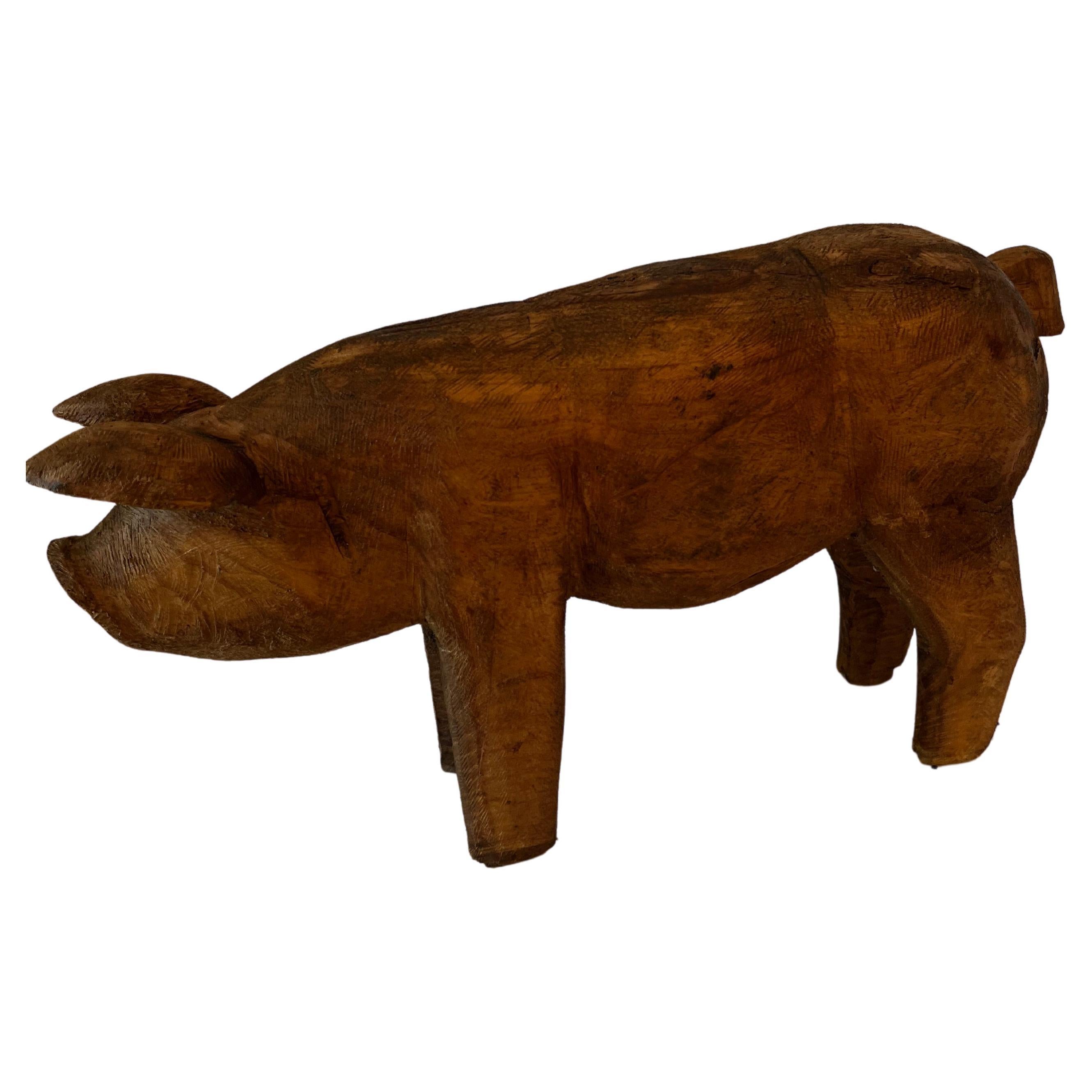 A hand Carved Wooden Pig - a compliment to many settings - great in the kitchen, on a shelf, console table, or even staged on a table in the garden.

He / she is the perfect little piglet, likely carved to show off at a store or butcher shop?  

A