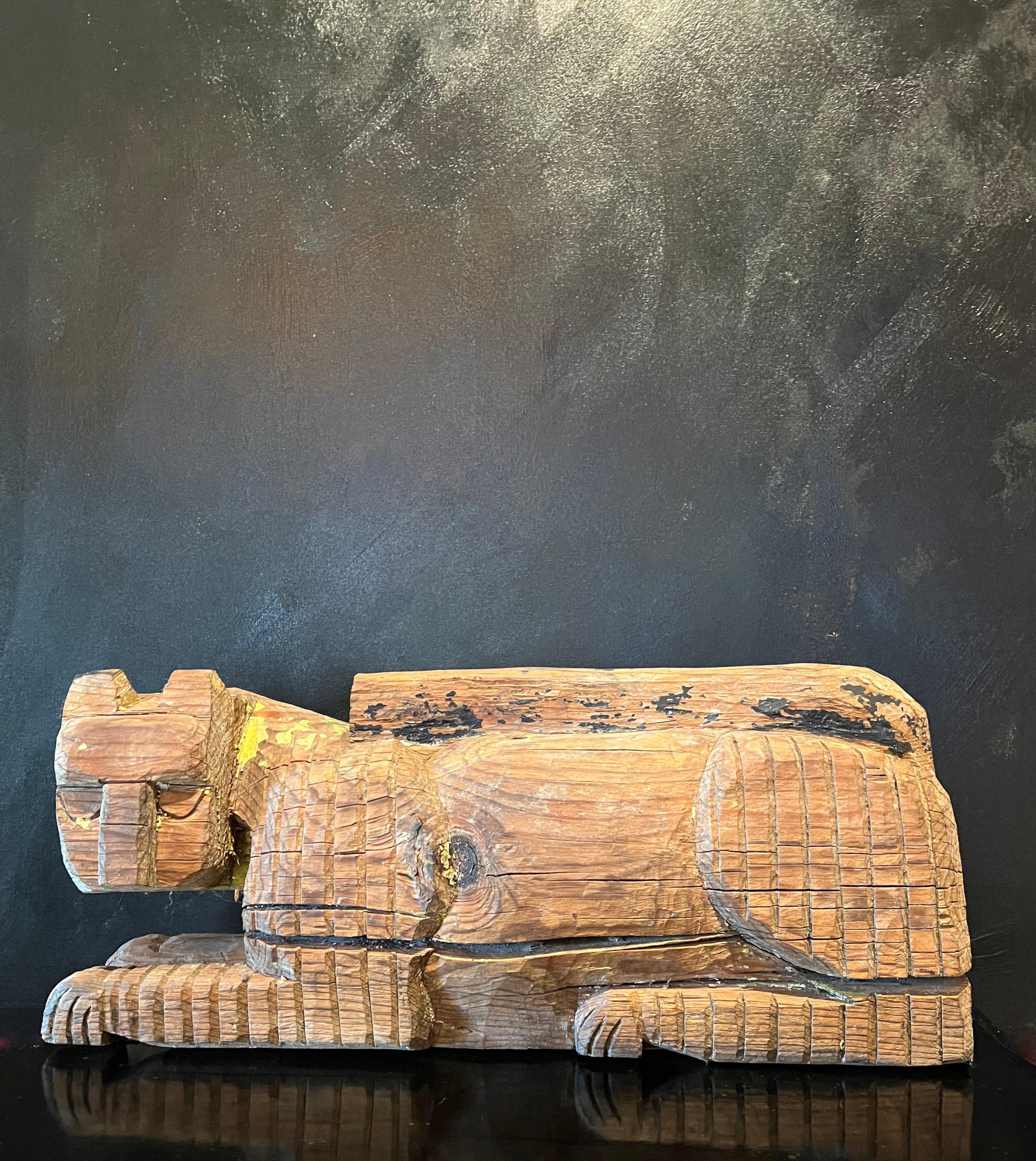 A wooden carved cat or Panther. This previously painted piece, or piece of wood, has the remnants of a yellow paint, and the markings of a cat.

A compliment to any shelf or table - a nice focal point. In the Folk Art Style, the piece is alluring