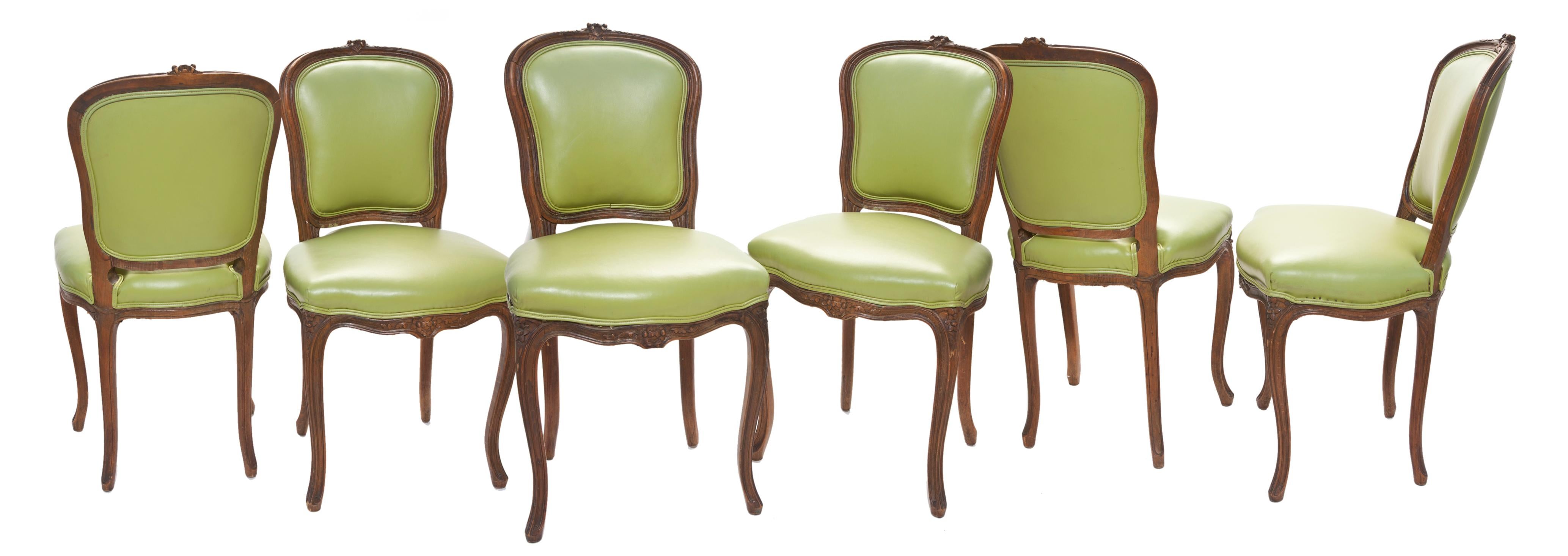 Hand Carved French Dining Chairs/ mid century chartreuse vinyl upholstery; set of four. The chairs for dining/game chairs sit on graceful curved & tapered legs.
Hand carved flowers embellish the top & seat frame.
Custom upholstery is available for