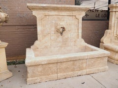Hand Carved French Limestone Wall Fountain with Wrought Iron Spout from Provence