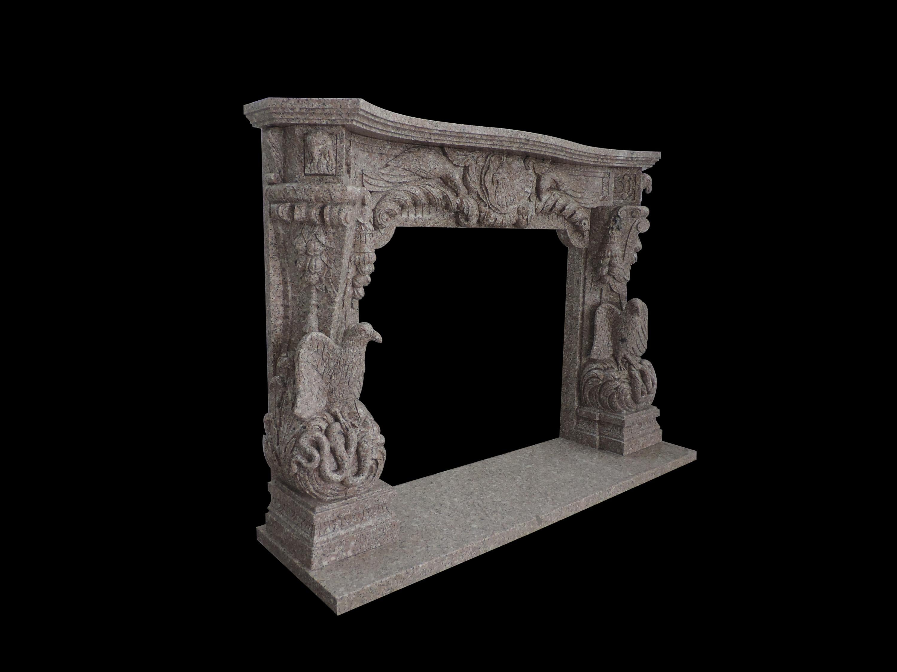 Beautiful hand carved granite eagle themed ornate fire surround with eagle profile frieze and open winged eagle corbels and eagle head end blocks with hearth.
