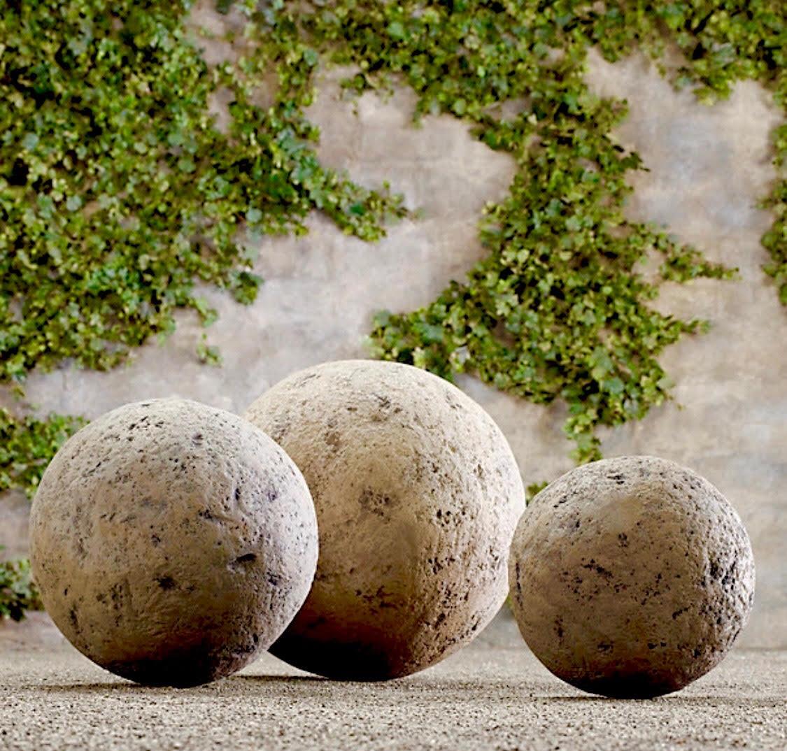 Resembling ancient catapult and canon balls these carved lava rock spheres are found in several sizes and can be used to accent your garden. Hand carved in the Mediterranean.