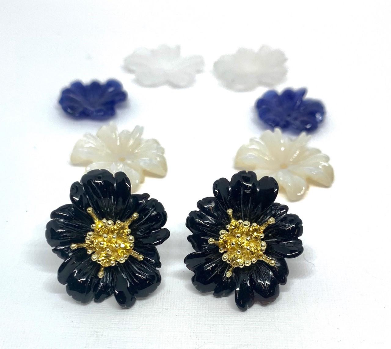 These finely hand-carved flower earring jackets are made of quartz, onyx, sodalite, and mother of pearl. They are interchangeable when worn with our hand made 18k yellow gold 