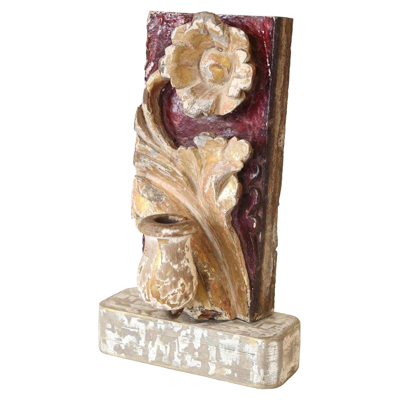 Hand carved giltwood candleholder from 18th century. Painted and gilded Italian fragment mounted on a custom base and served as a festive tabletop accent.