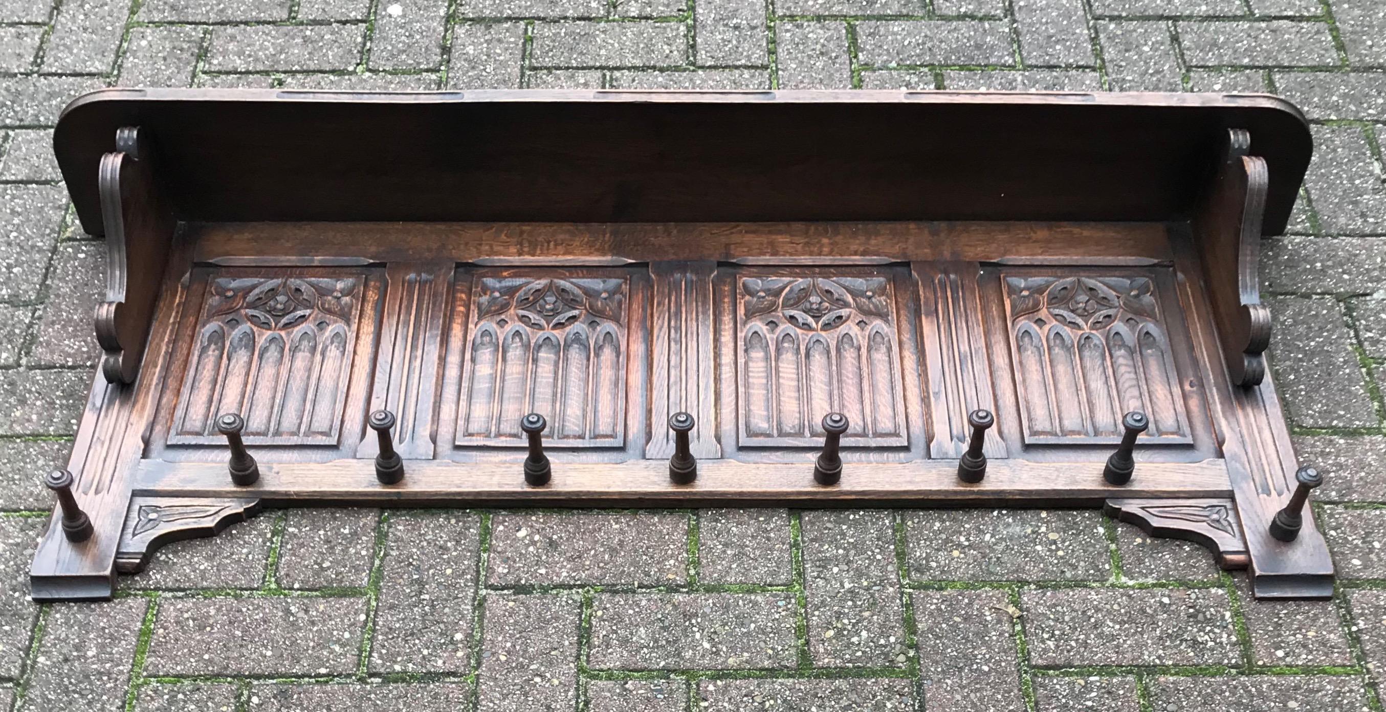 Wonderful craftsmanship solid oak Gothic Revival coat-rack.

Anyone who has ever visited a Gothic (Revival) church or other Gothic style building will immediately recognize the same stunning elements in this all handcrafted coat rack. The symmetry