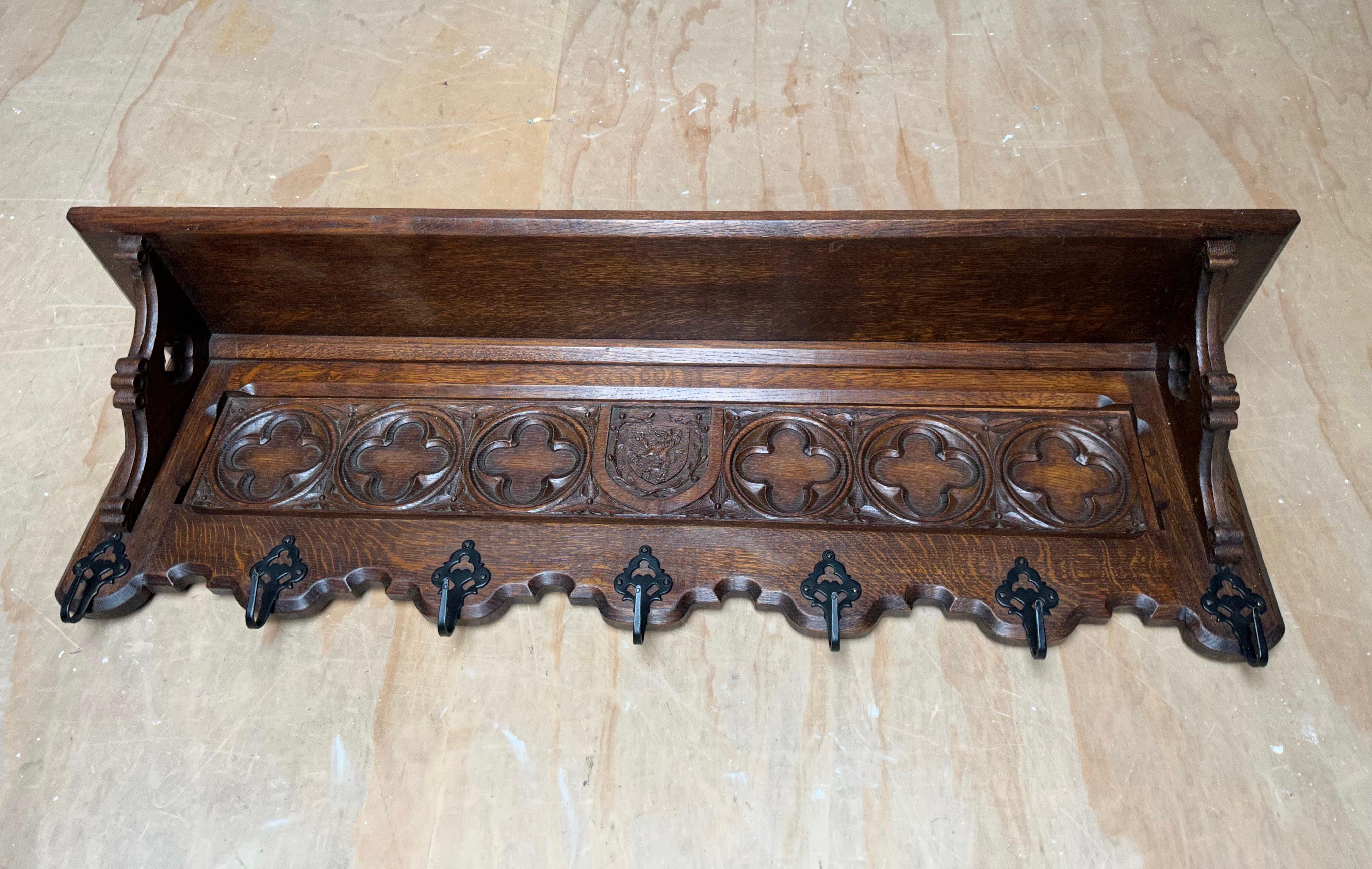 Wonderful craftsmanship, solid tiger oak Gothic Revival coat-rack.

Anyone who has ever visited a Gothic (Revival) church or other Gothic style building will immediately recognize the many of the same elements in this hand carved coat rack. The