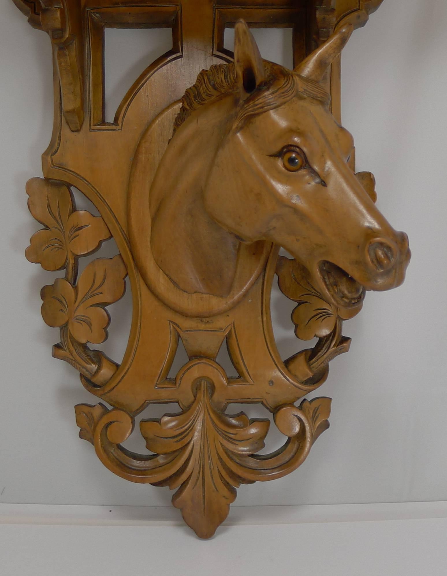 A handsome and beautifully executed fruitwood hand-carved wall bracket featuring a horse's head retaining two endearing glass eyes.

Late Victorian in era, dating to circa 1890 and without damage.

Measures: 6 1/4