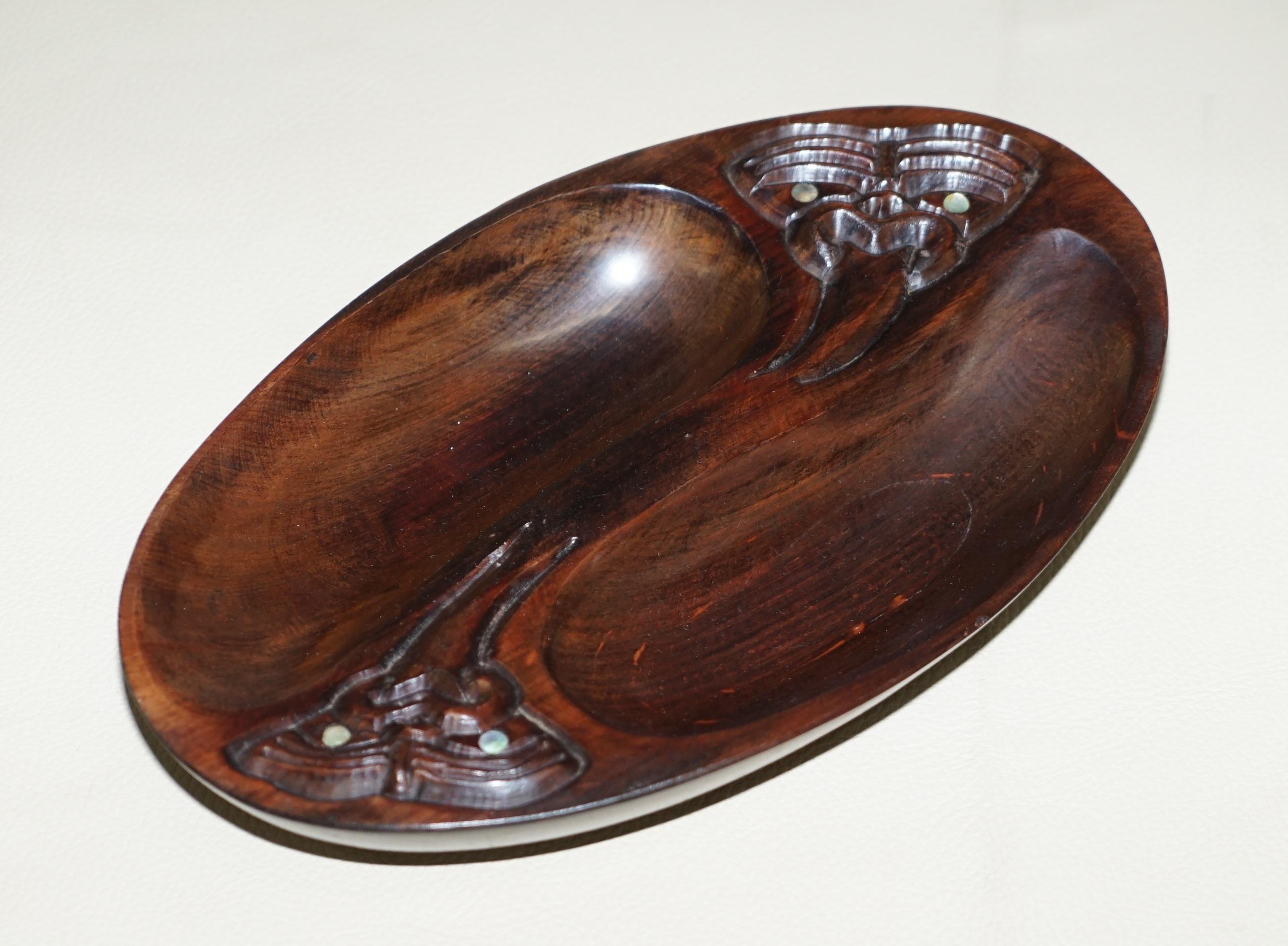 Wimbledon-Furniture

Wimbledon-Furniture is delighted to offer for sale this lovely decorative Arts & Crafts style hand made in New Zealand Wood Carved LTD trinket bowl with mother of pearl eyes

A good looking decorative and vintage bowl, ideally
