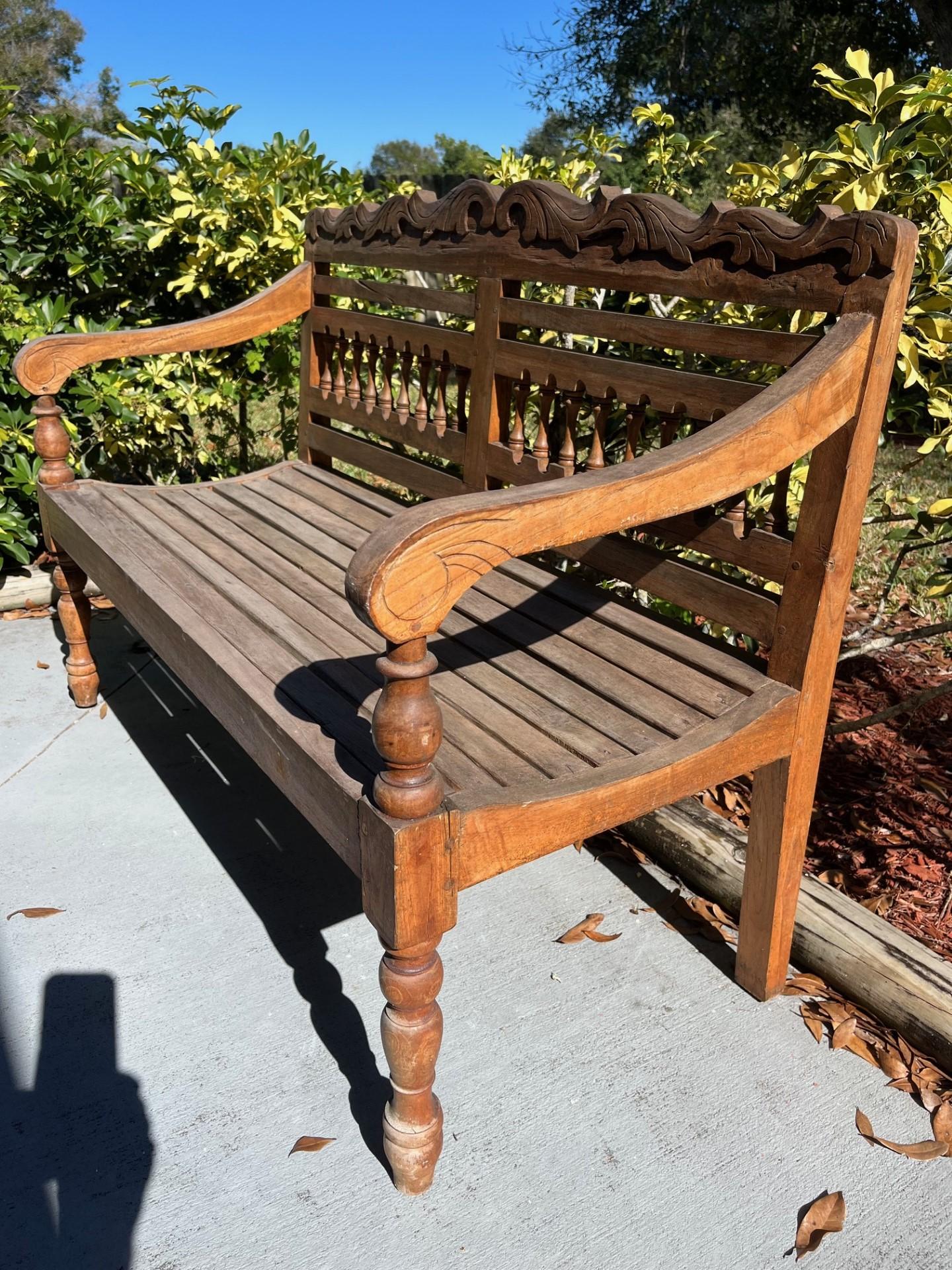 Hand Carved Indonesian 1980s Colonial Teak Wooden Garden Bench In Good Condition For Sale In Vero Beach, FL