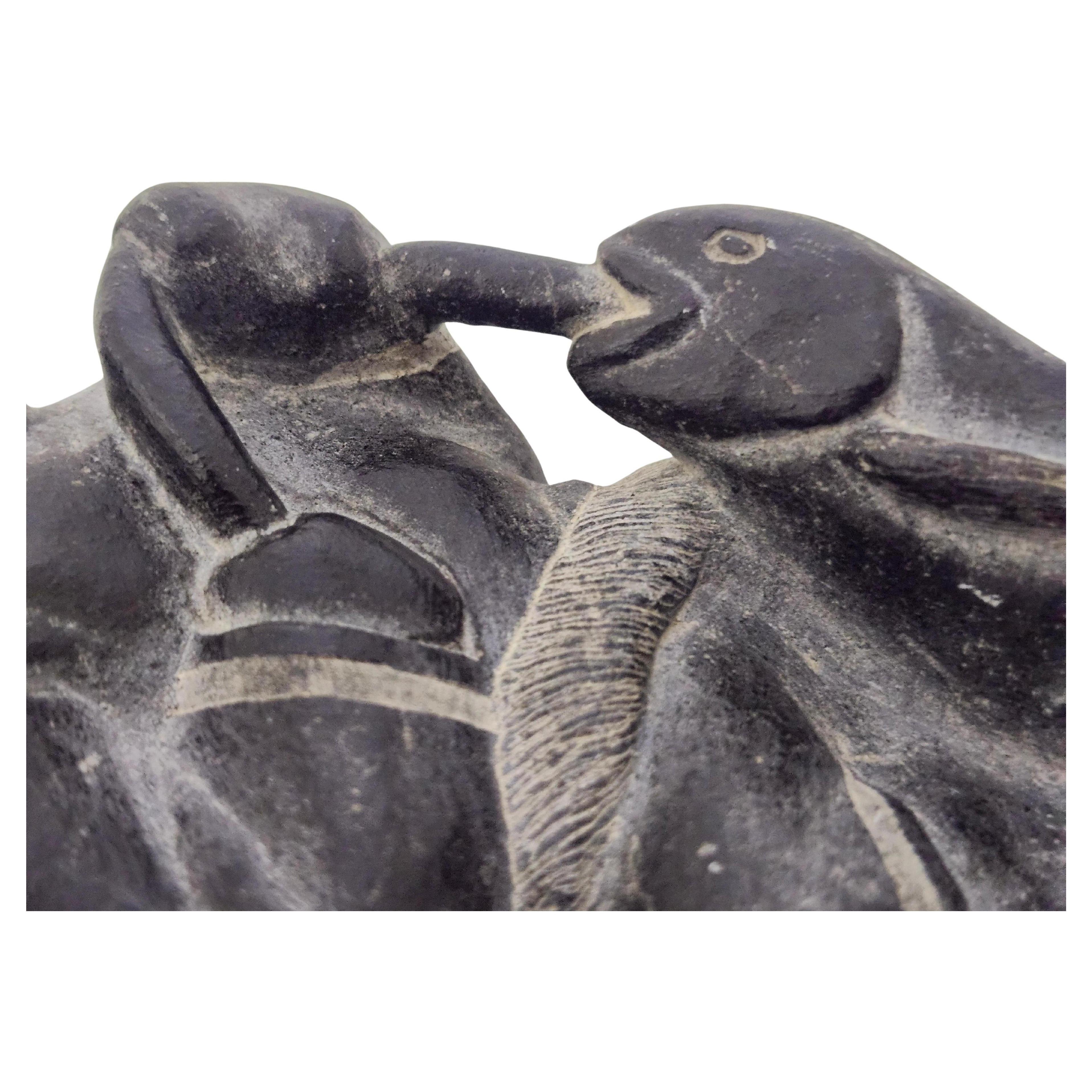Canadian Hand Carved Inuit Folk Art Soapstone Figure of  a Man with a Fish C1975 For Sale
