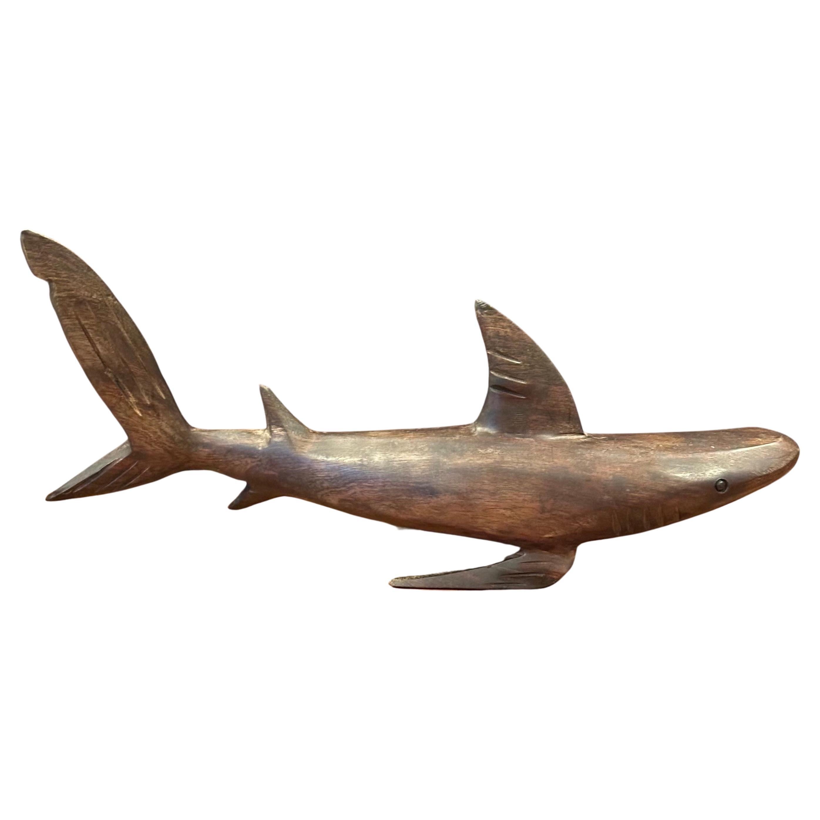 A very cool hand carved ironwood shark sculpture, circa 1980s. The piece is in very good vintage condition and measures 15