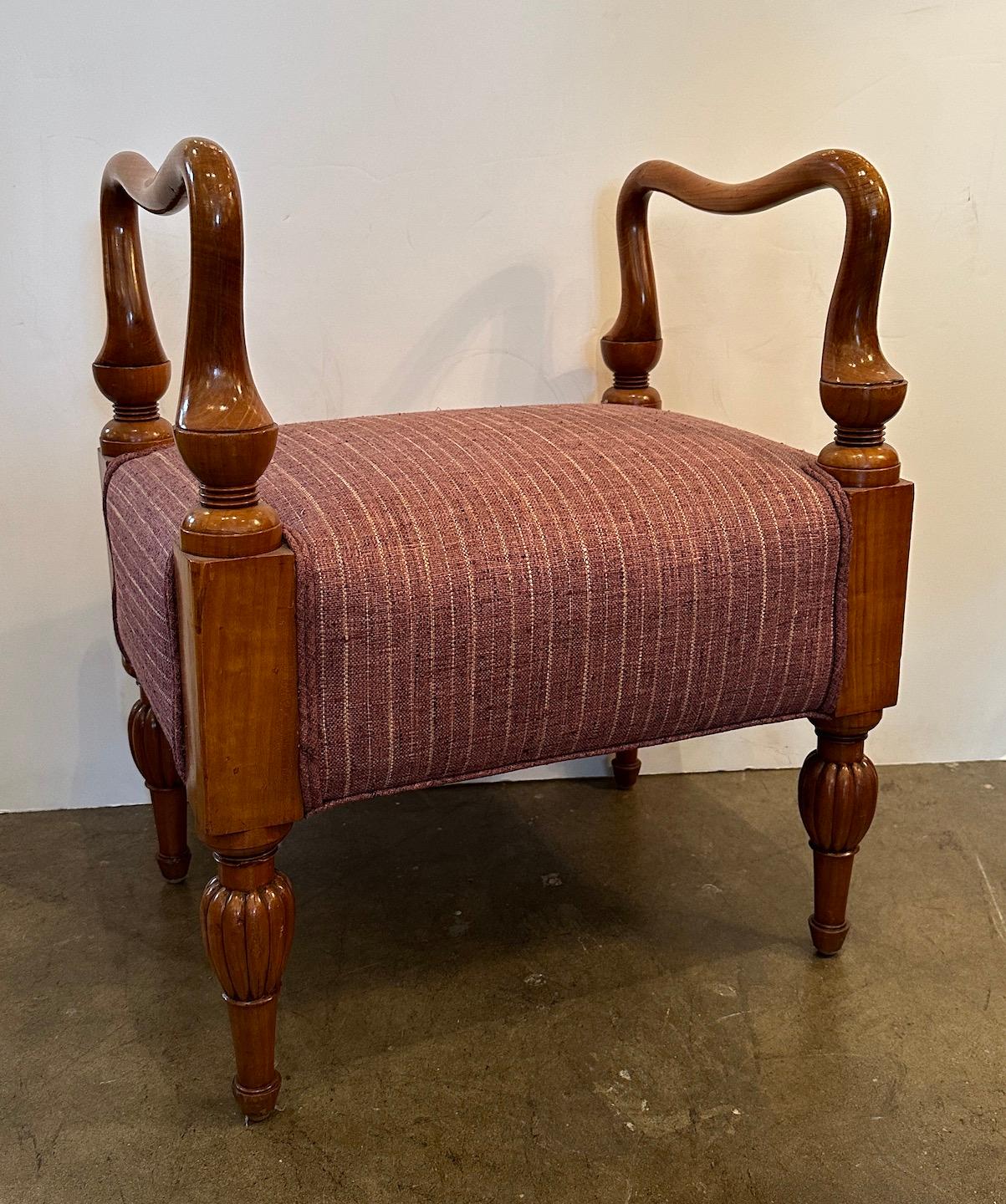 Hand carved fruitwood bench with tapered, lobed feet and serpentine rails. New upholstery.