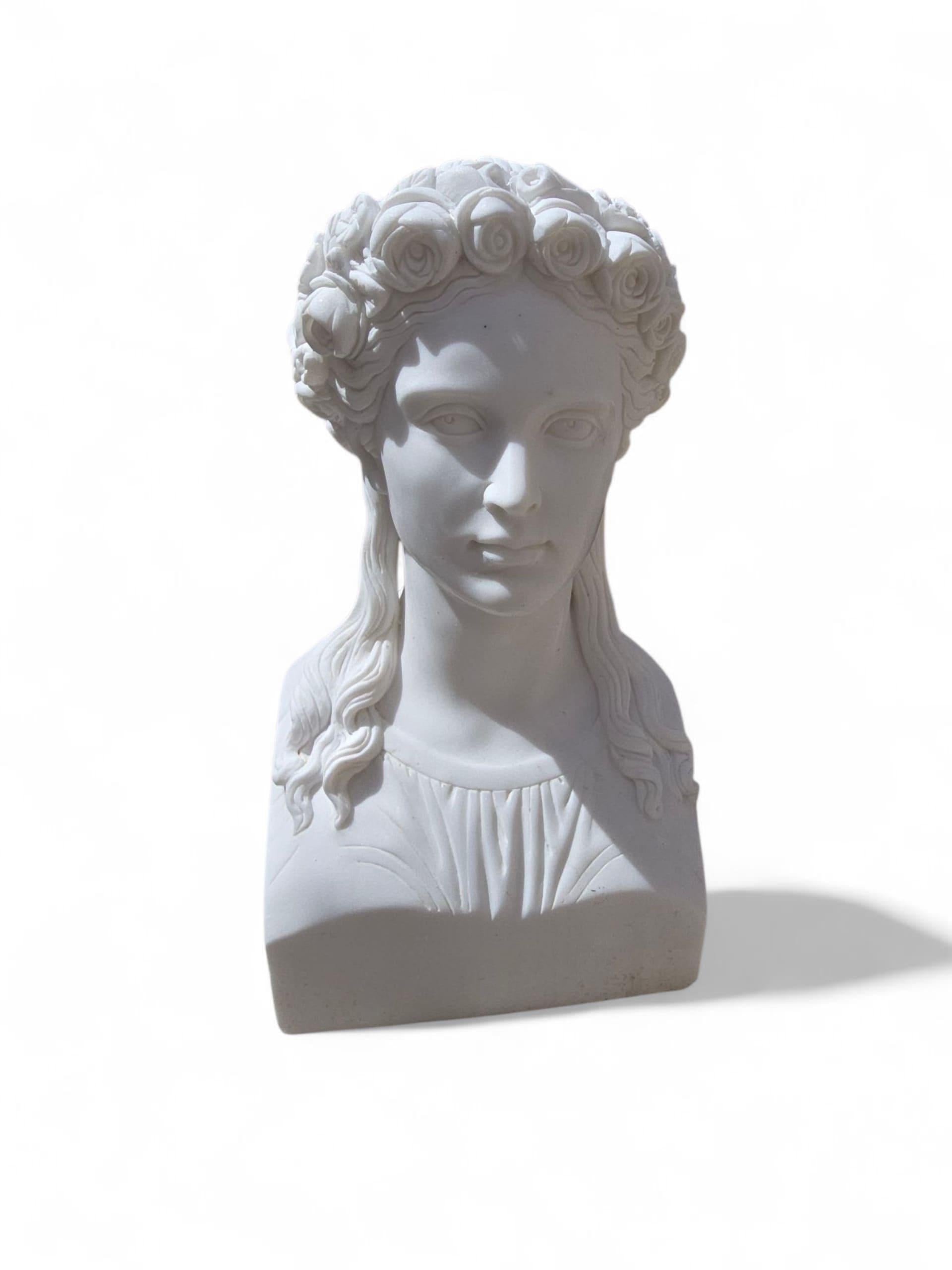 Refined and finely detailed marble bust of a Greek woman, hand-carved in Italy during the 20th century. Inspired by classical antiquity, the sculpture features delicate facial features, flowing hair, and elegant proportions—capturing the timeless
