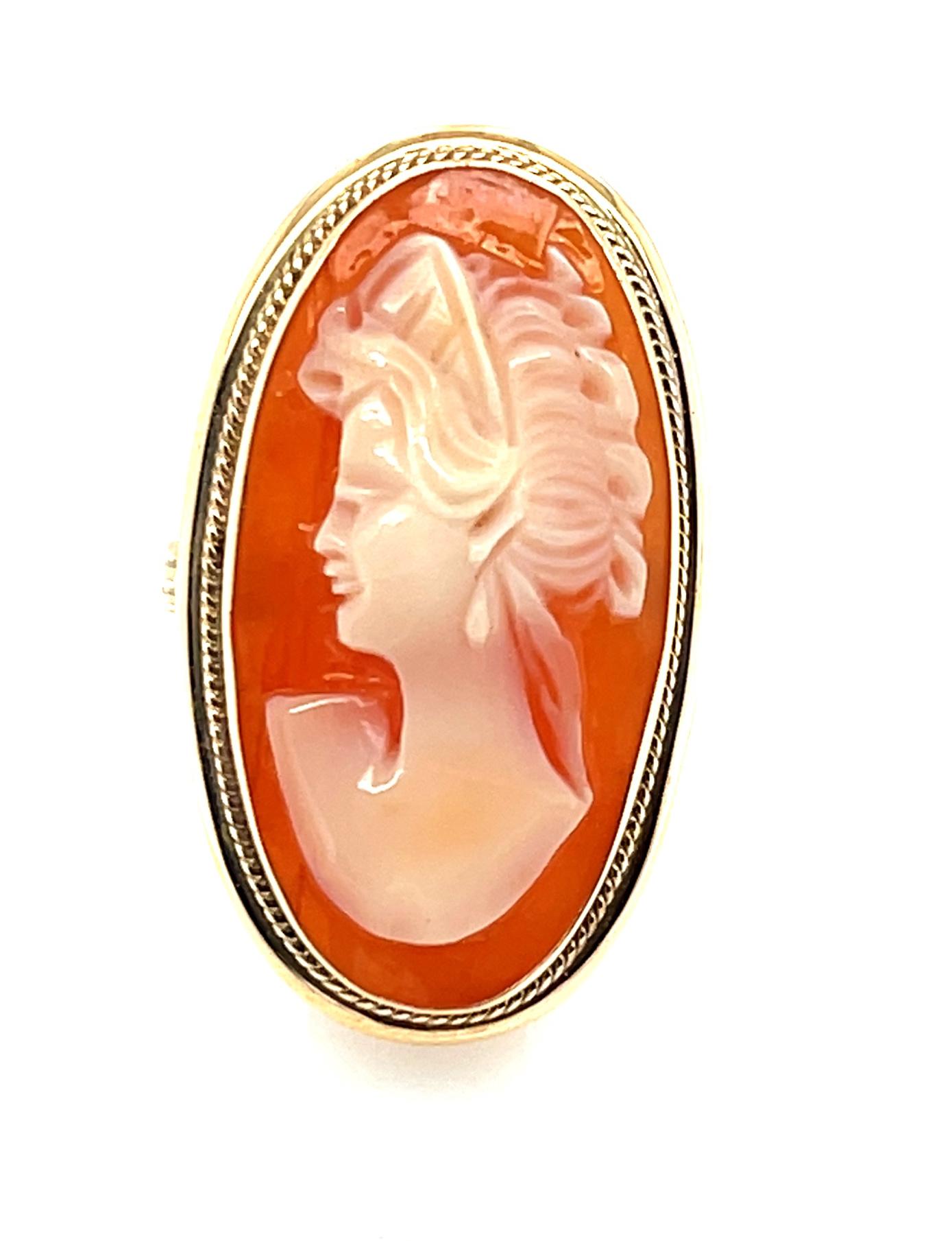 This pretty cameo ring features a shell cameo that was hand carved in Italy and set in a beautiful 14k yellow gold ring. The ring was made by one of our Master Jewelers using artisan skills and labor-intensive techniques that are rarely seen in