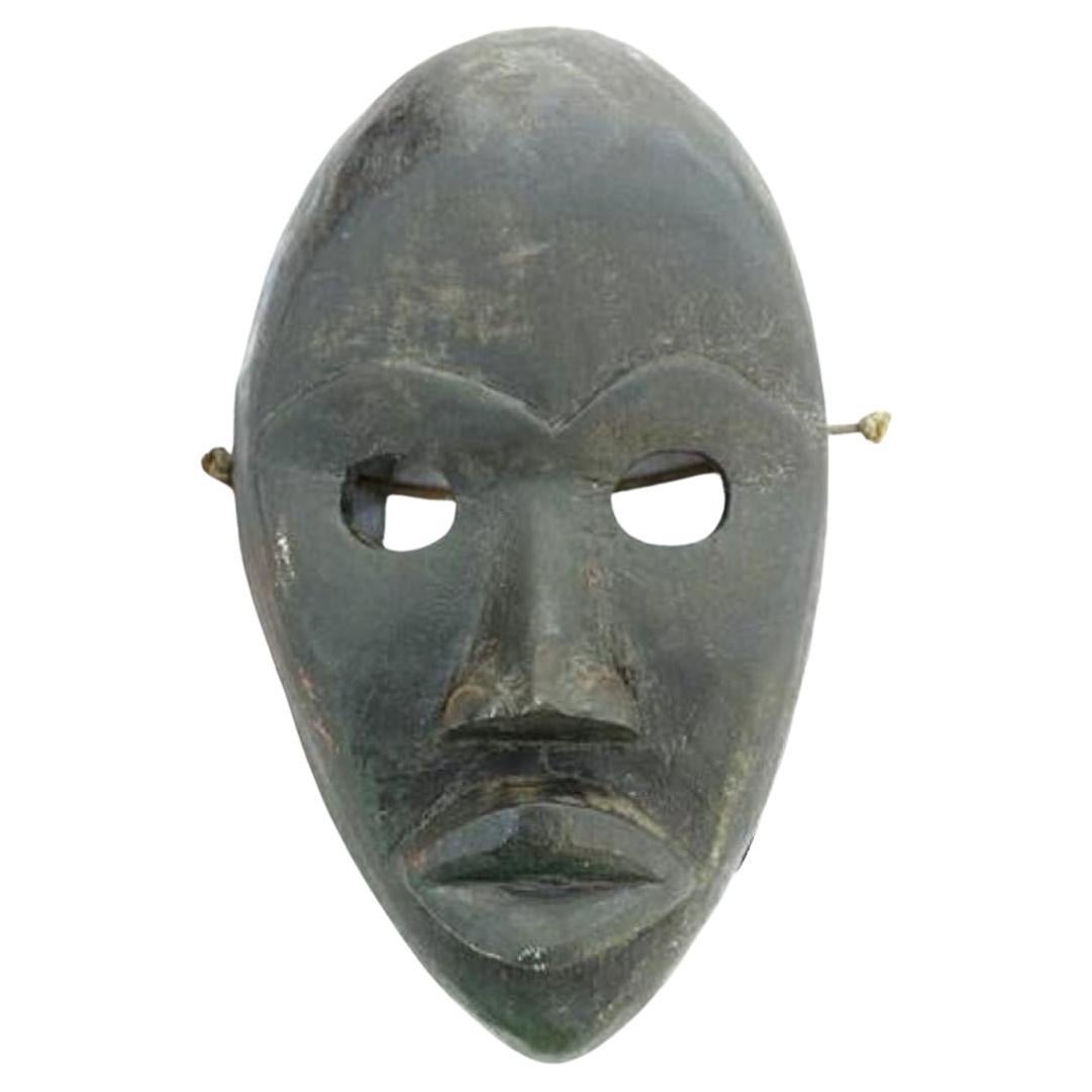 Masque de festival et de rituel tribal de la côte ivoire sculpté à la main de la tribu Dan