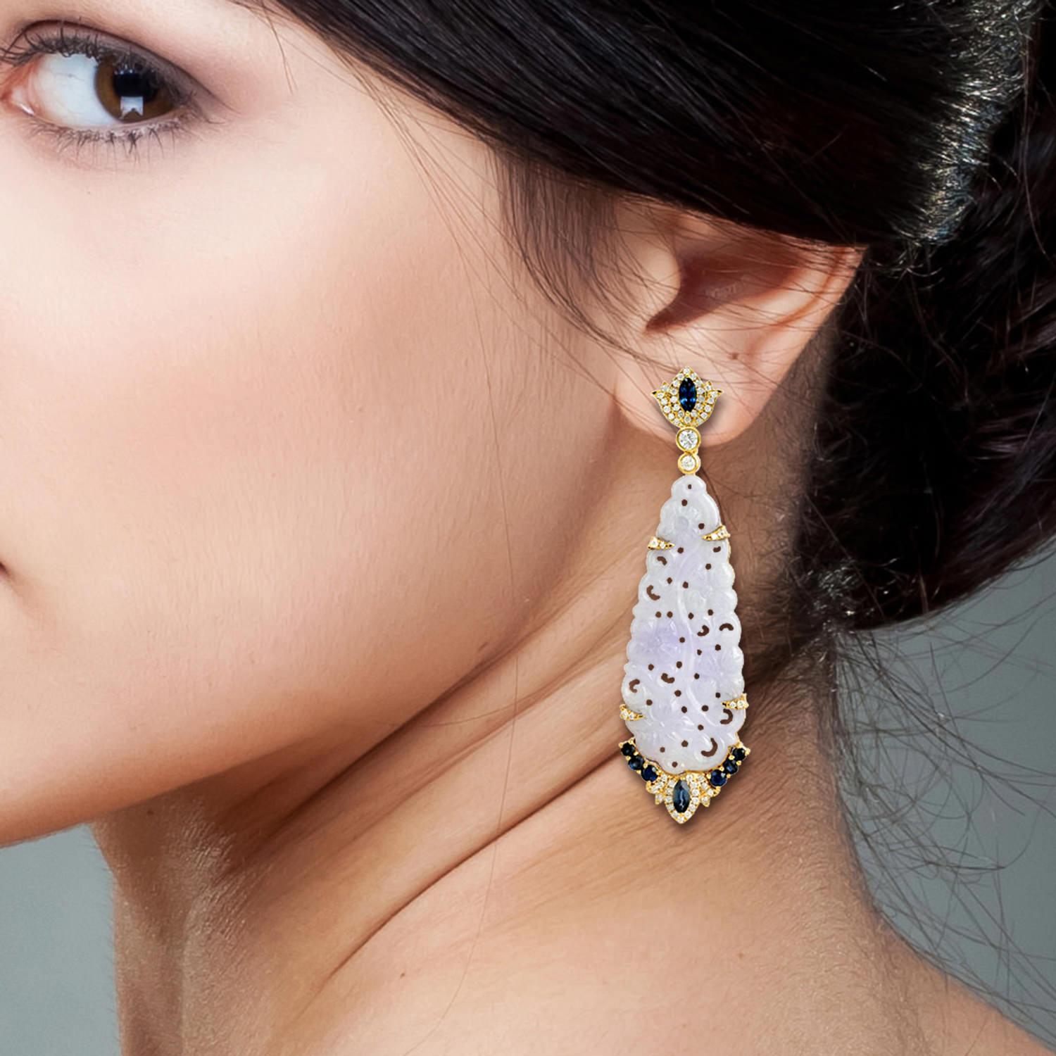 These stunning hand carved Jade earrings are thoughtfully and meticulously crafted in 18-karat gold. It is set in 31.04 carats Jade, 1.74 carats blue sapphire and .79 carats of sparkling diamonds.

FOLLOW  MEGHNA JEWELS storefront to view the latest