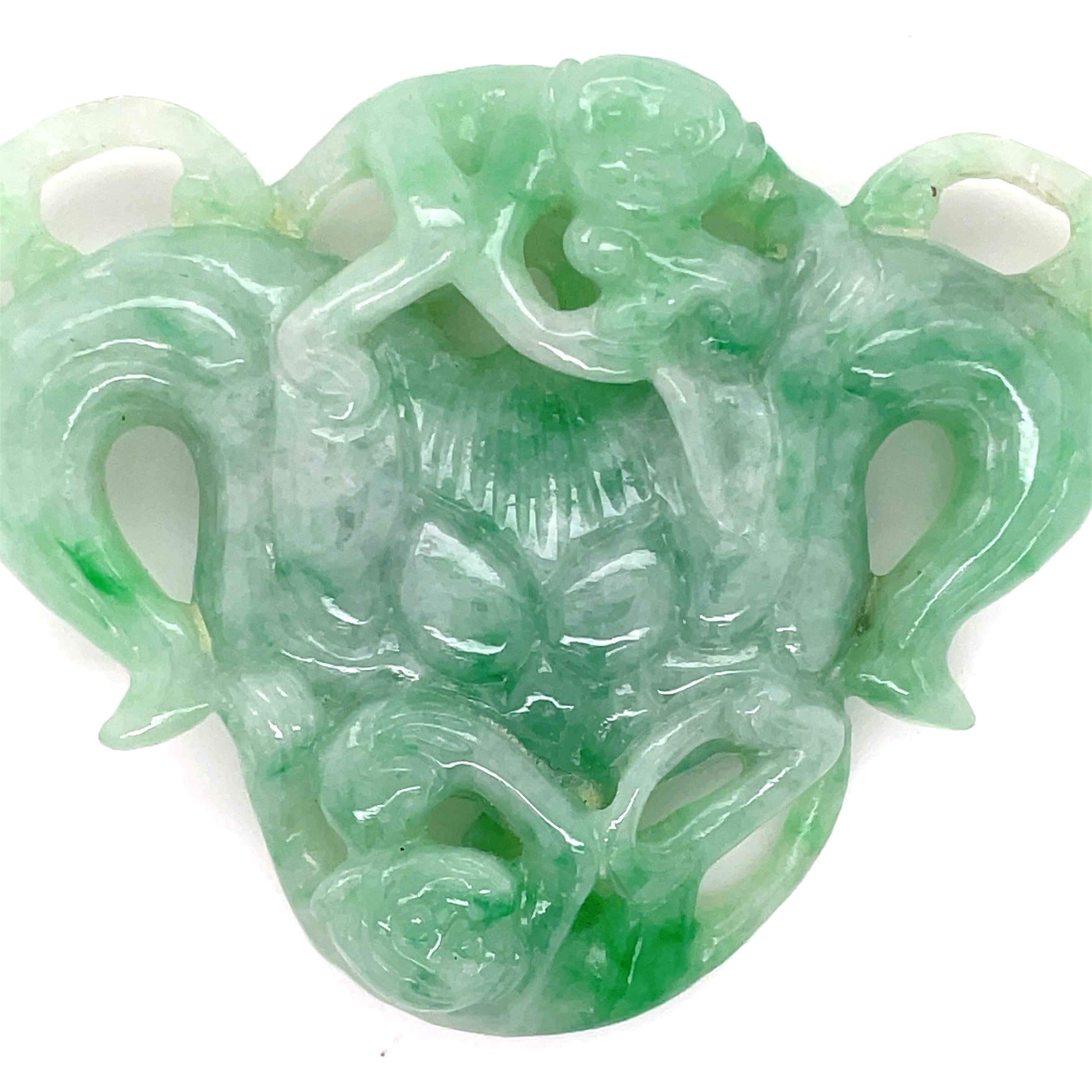 This jade carving, measuring 60 x 48mm, is sourced from the finest jade mines in Myanmar. 

This natural gem is cherished for its deep symbolism of prosperity, protection, and balance. 
Jade has long been associated with good fortune and spiritual