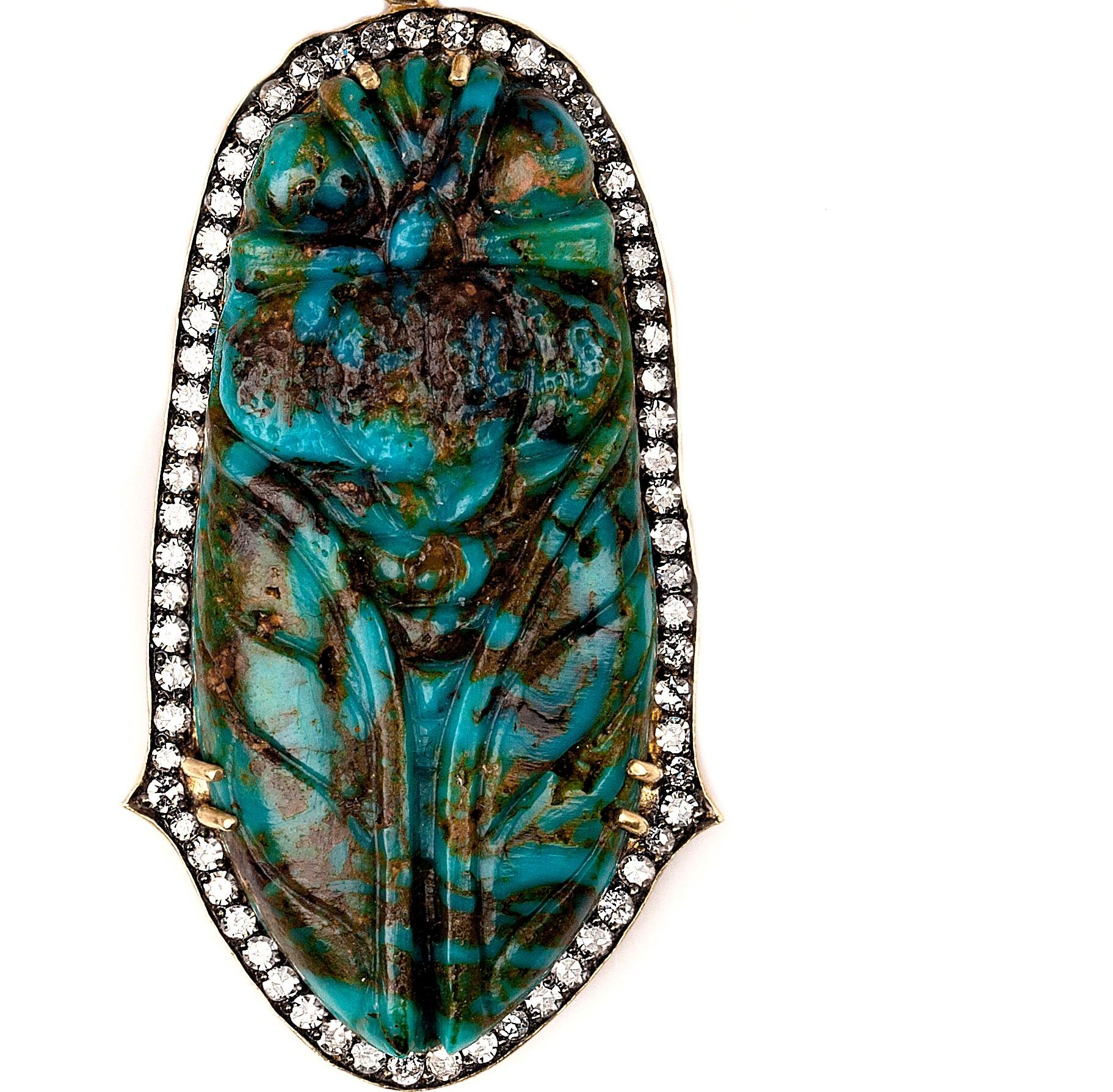 One-of-a-kind hand carved Cicada out of a perfectly mottled specimen Kingman Turquoise in the richest of turquoise hues.  This removable pendant is surrounded by a white diamond halo with Sylva's signature thorn motifs and set in 18k yellow gold. 