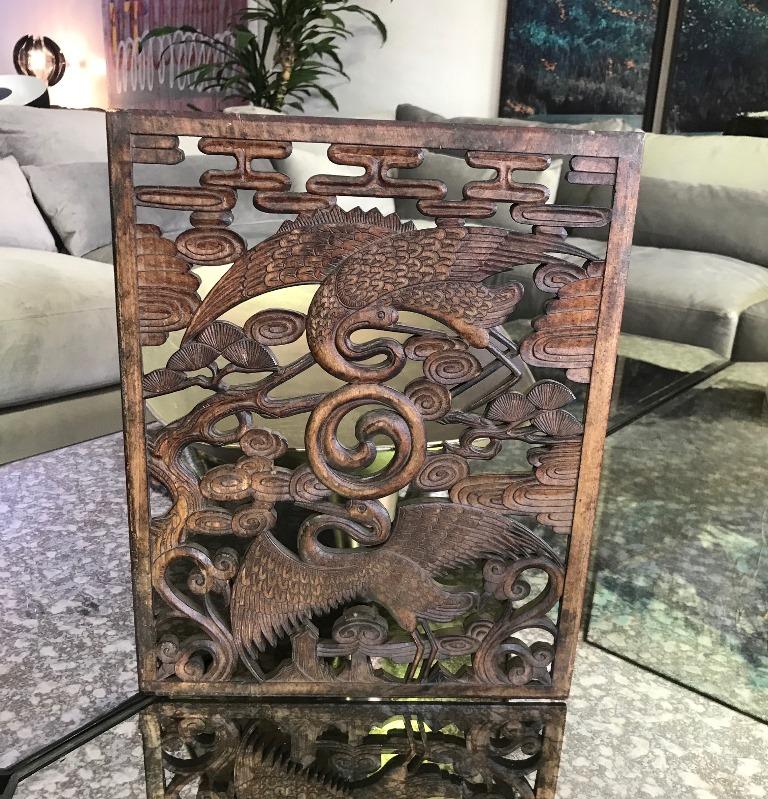 Masterfully carved and ornately detailed Korean wood panel of two sacred cranes. Perhaps at one point part of a screen or window. 

Great accent or wall piece. Eye-catching in any setting.

Dimensions: 15