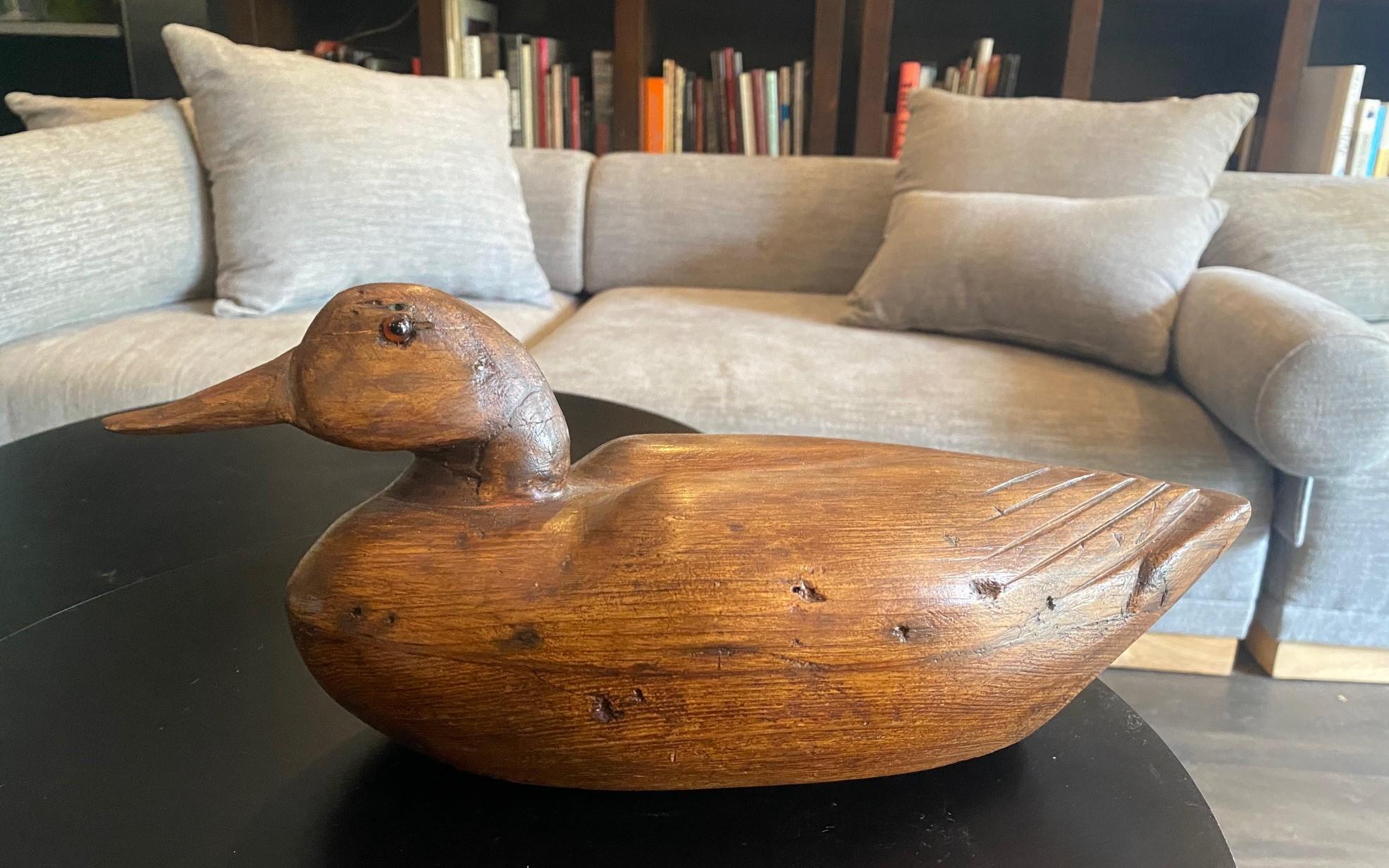 A fantastic early to Mid-20th Century handmade/hand-carved wood duck or mallard decoy with glass eyes. 

From an impressive Los Angeles vintage duck and antique swan decoy collection.  

This piece has a beautiful, rich patina acquired with age, 