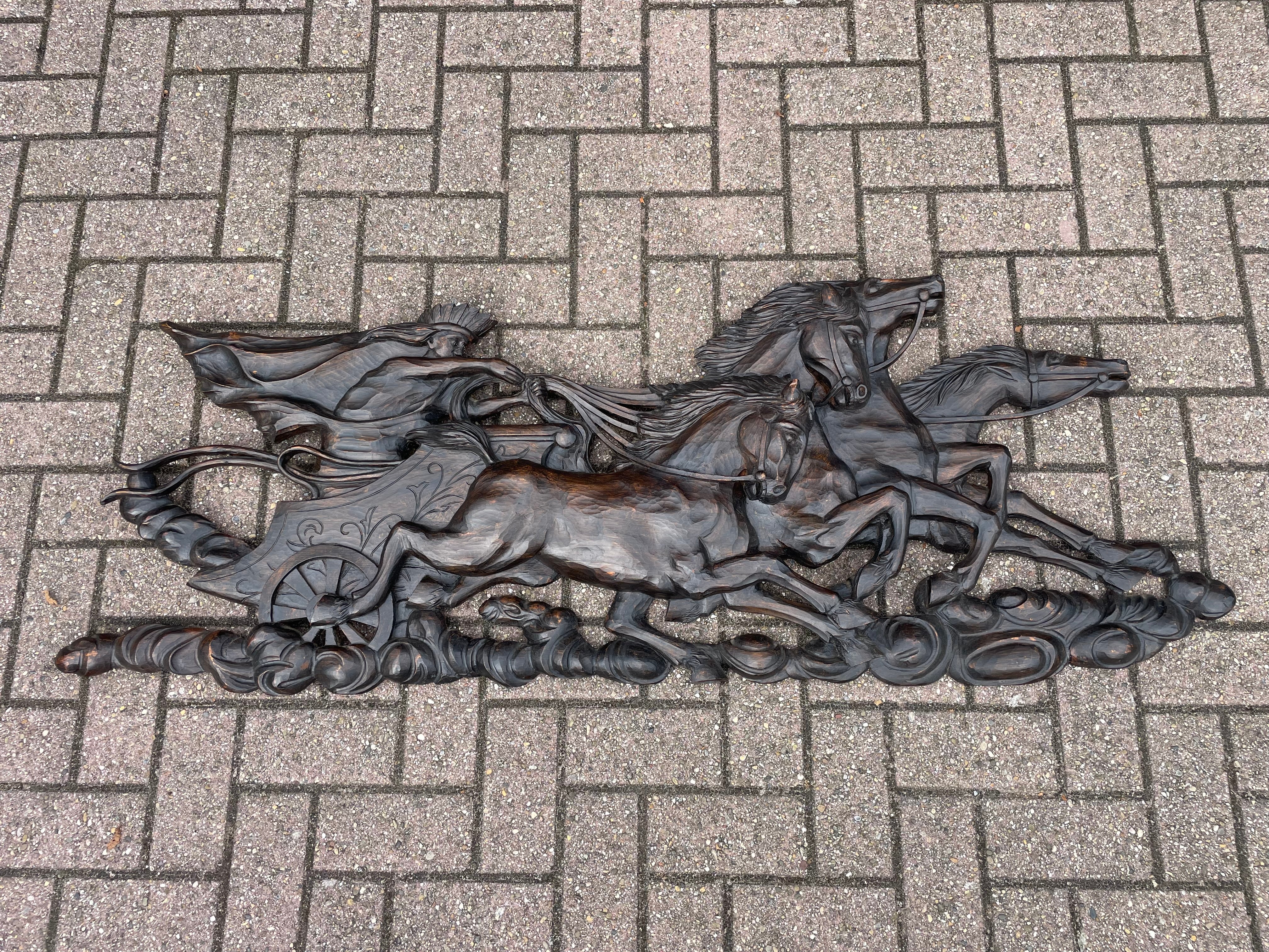 This large wall sculpture is another one of our recent rare finds.

This early to mid 20th century made wall sculpture depicts the (Greek) sun god Helios riding his charriot through the clouds. The quality of the carvings reveils the work of a