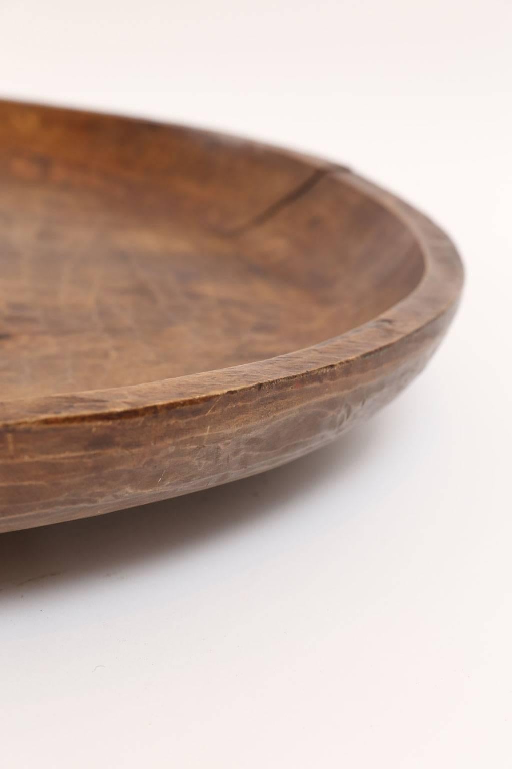 Hand-carved Lazy Susan from large 19th century primitive shallow wooden bowl mounted on a recent swivel base.
