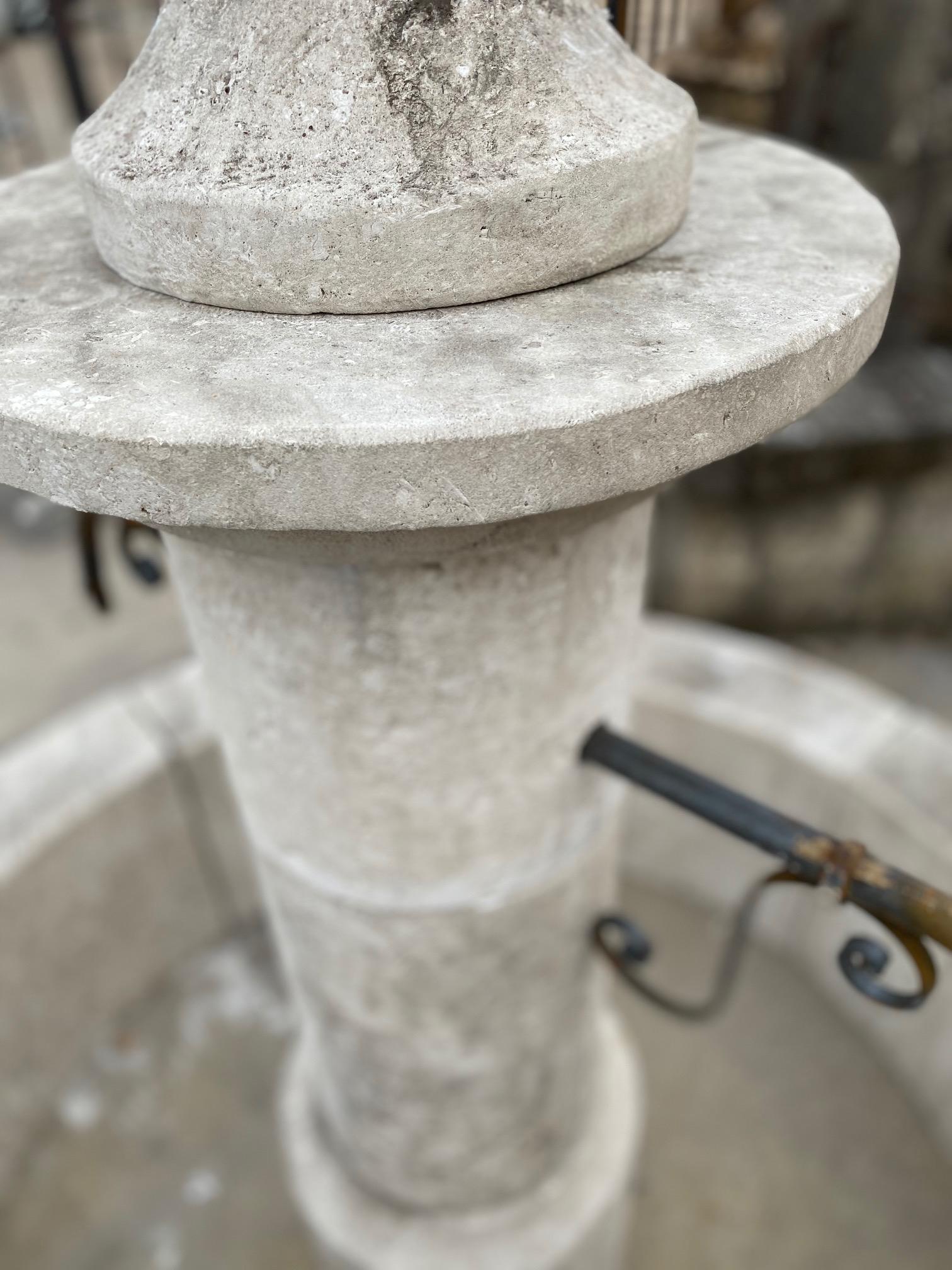 Here we offer a hand carved limestone central fountain with two brass down spouts. This fountain has a large, deep basin and will provide the acoustics of an old world fountain to your courtyard. The design is simplistic and straight lined therefore