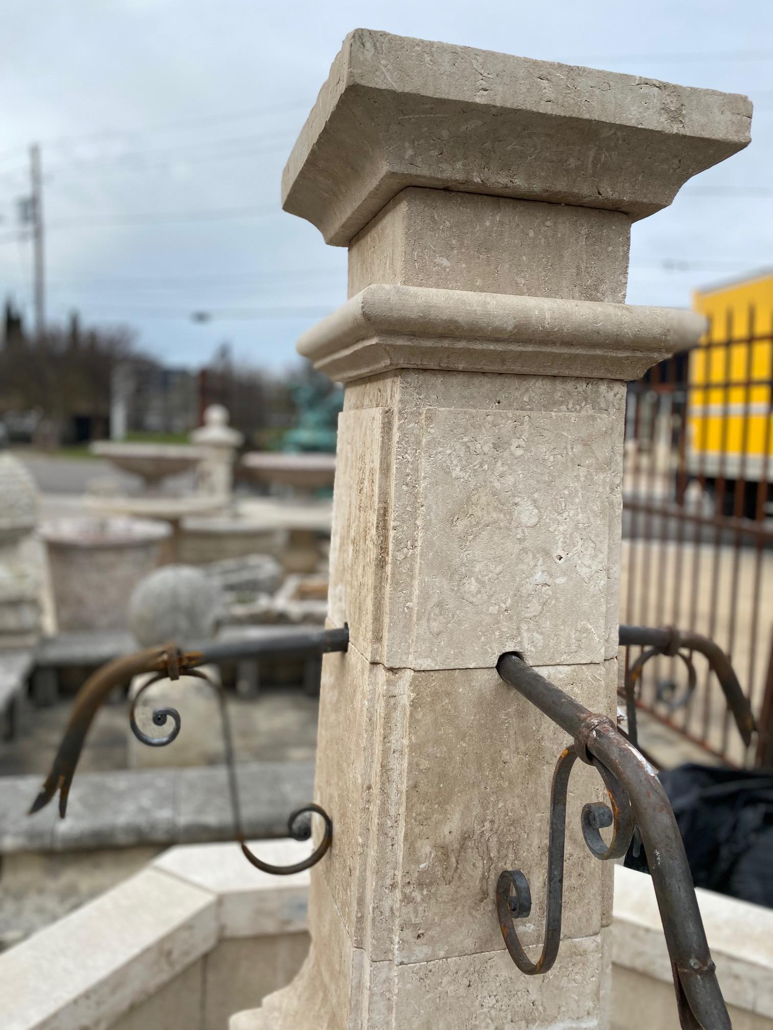 Here we offer a hand carved limestone central fountain with four iron down spouts. This piece stands tall and can be admired from a distance as part of the landscape design or be the focal point of your courtyard or garden as it fills the air with