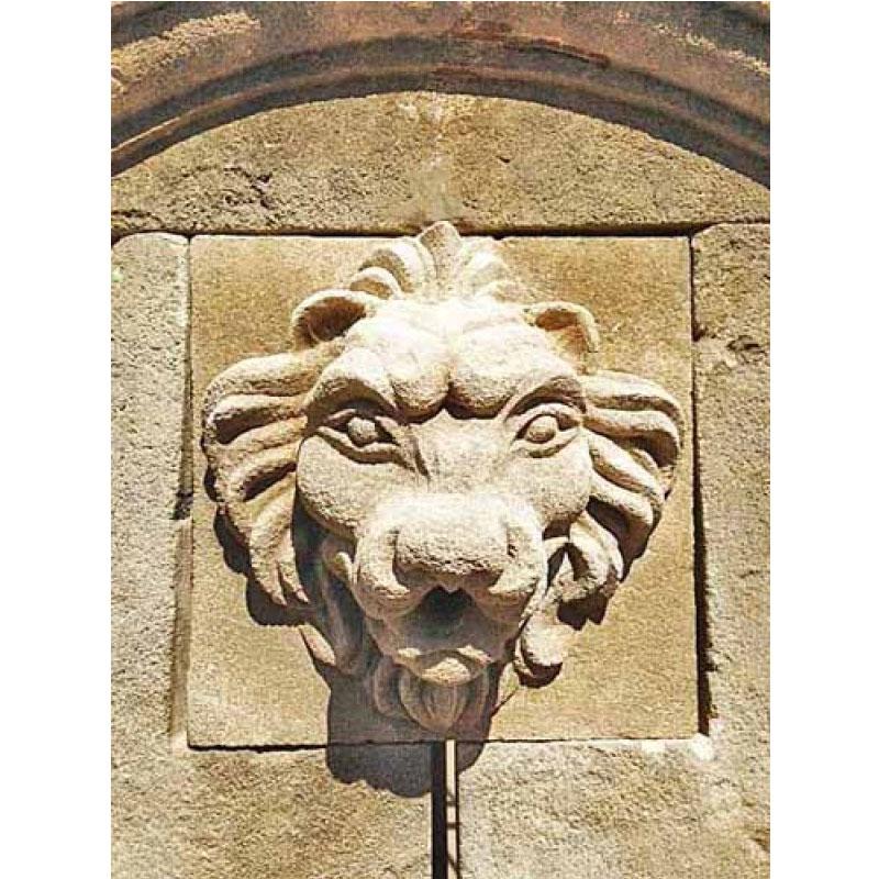 Here we offer a hand carved limestone wall fountain that features the head of a lion carved from limestone as a water exit. This piece is completed by scrolls down each side of the back plate and an over hanging crown. The basin wall is finished off