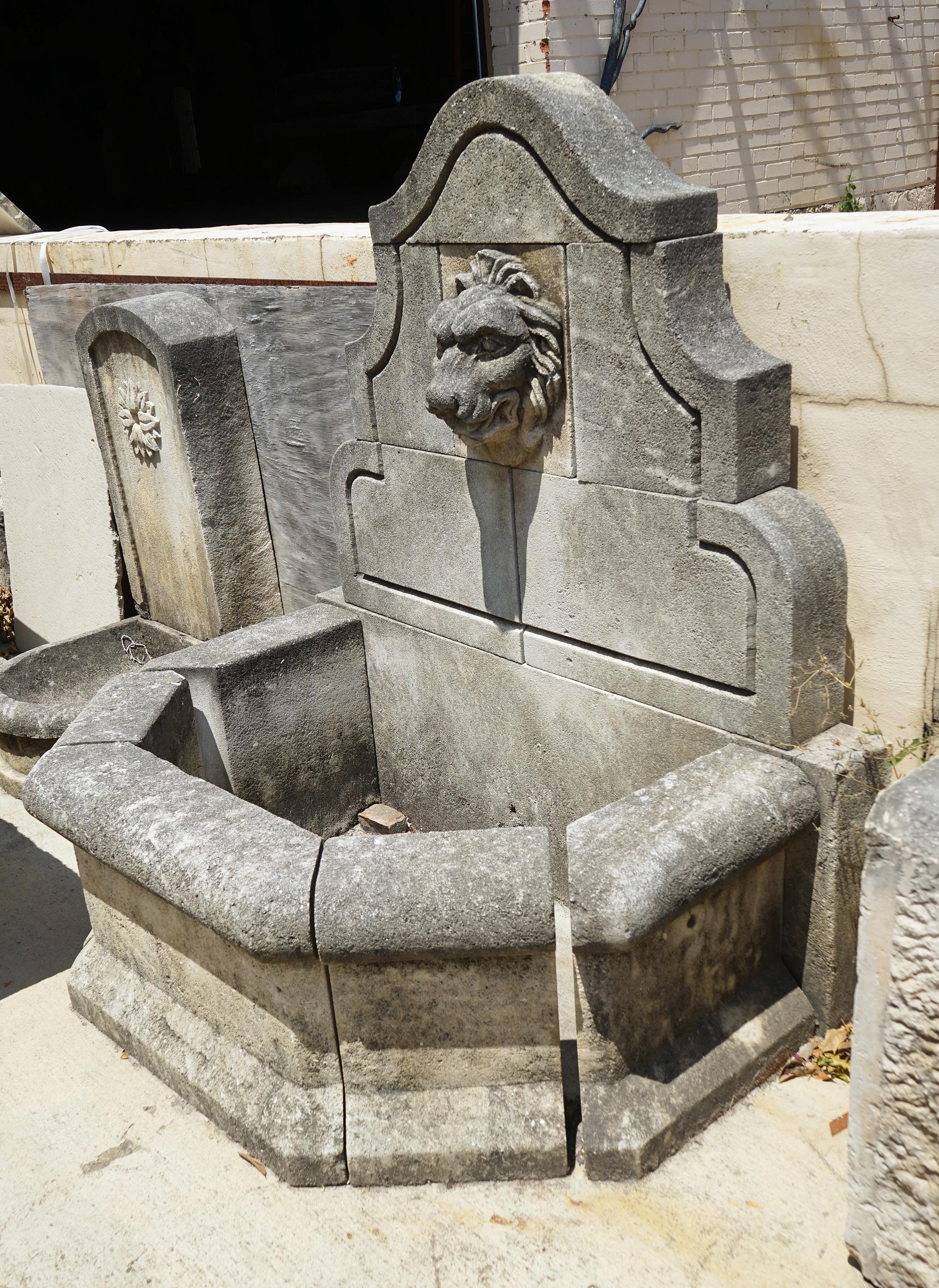 French Hand Carved Limestone Wall Fountain with Lion Medallion
