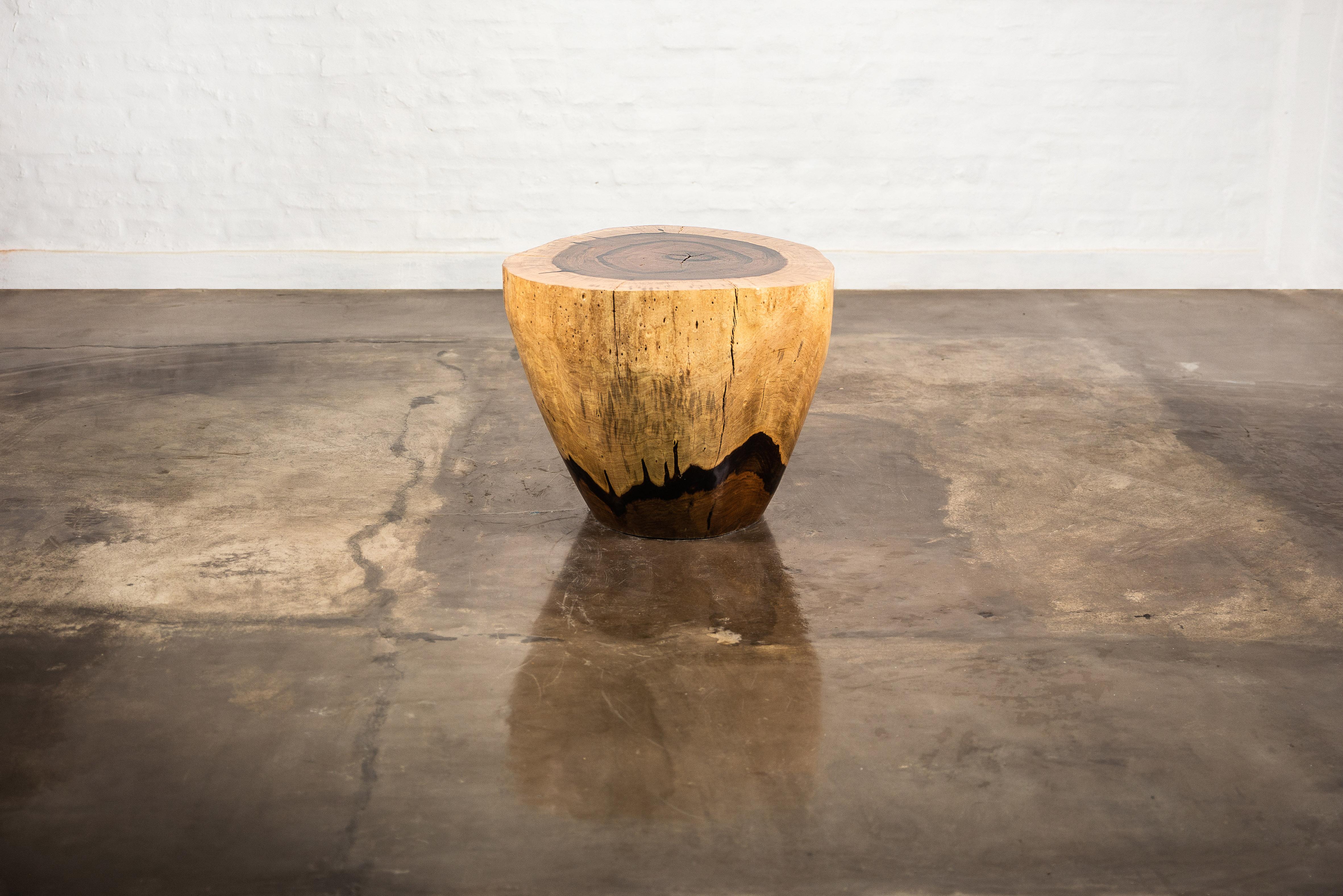 Each table in the Francisco Collection is hand carved from a solid trunk of exotic wood, then sanded and finished naturally to highlight its natural beauty. The top features a Live Edge and is tapered down in an elegant curve.

Dimensions: 24.6’’
