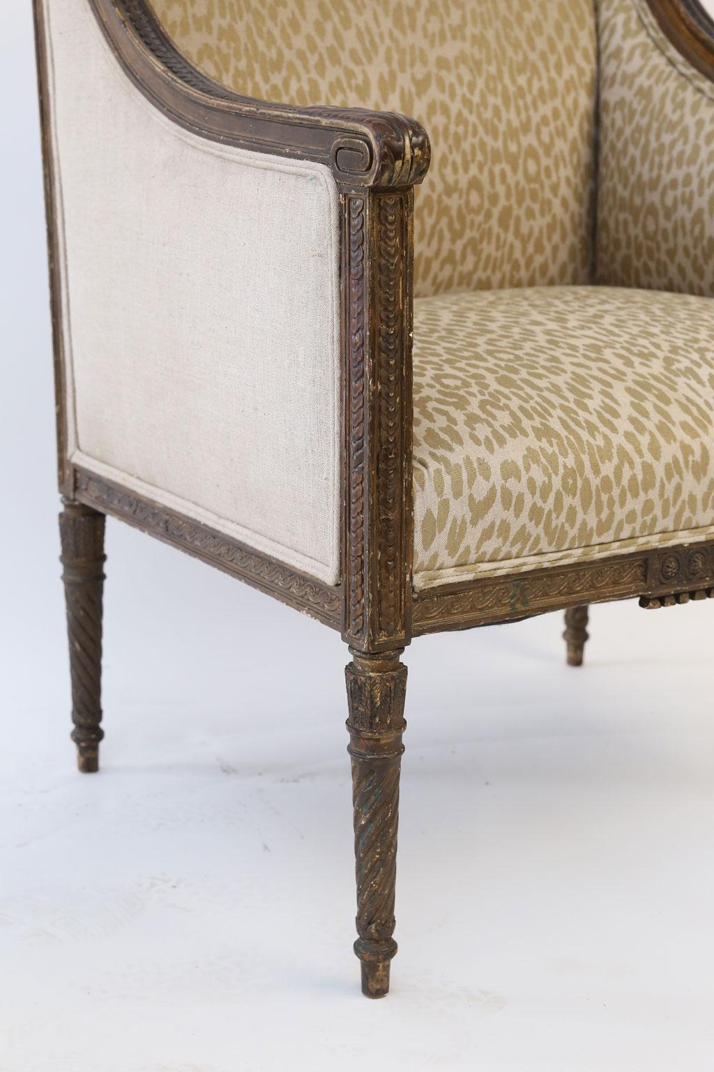 Hand Carved Louis XVI Bergère Amrchair In Fair Condition For Sale In Houston, TX