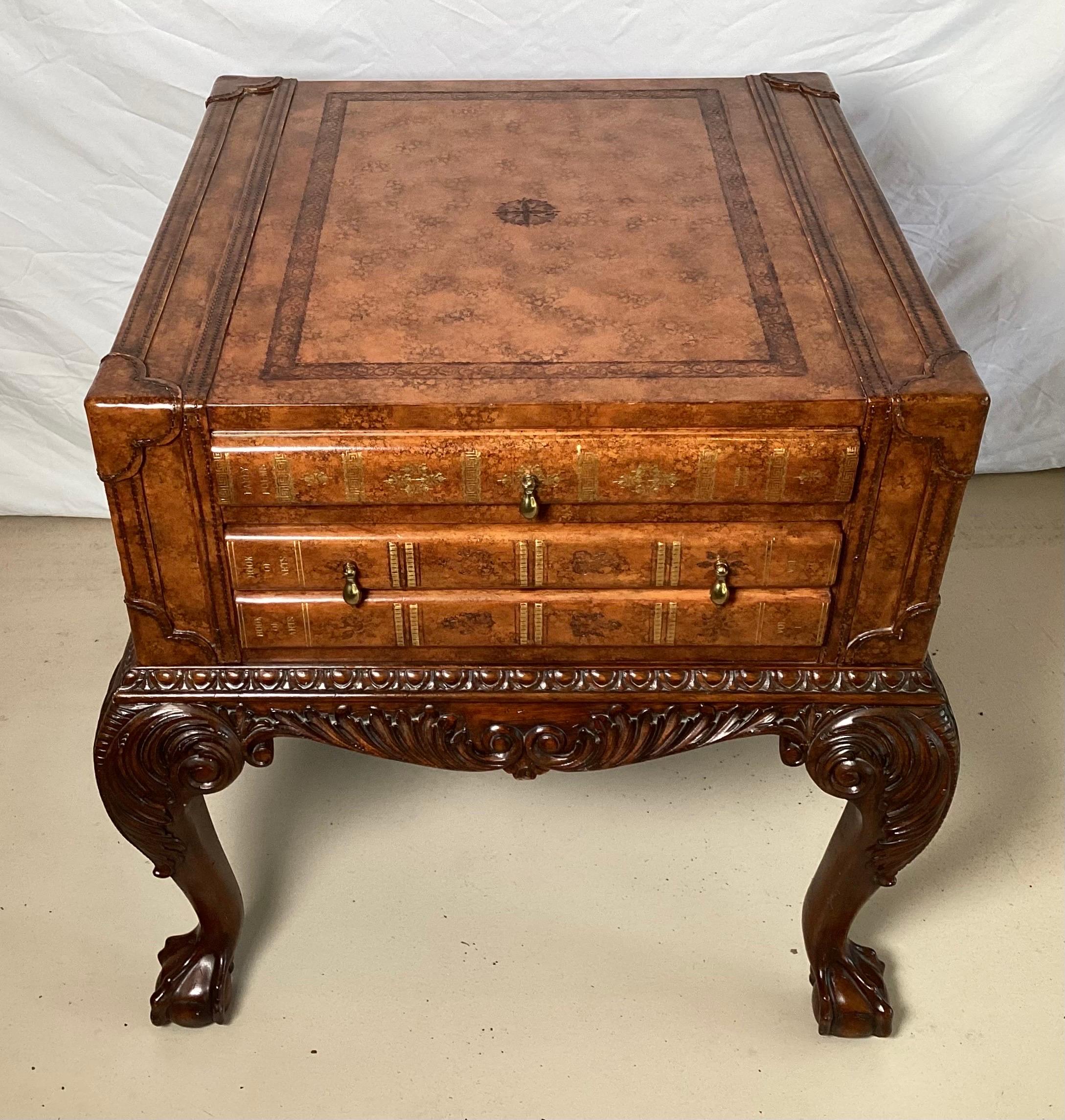 Beautiful carved mahogany and leather functional game table by Maitland Smith. The leather top, with drawers that wpull out for game boards with a Georgian style carved base.
