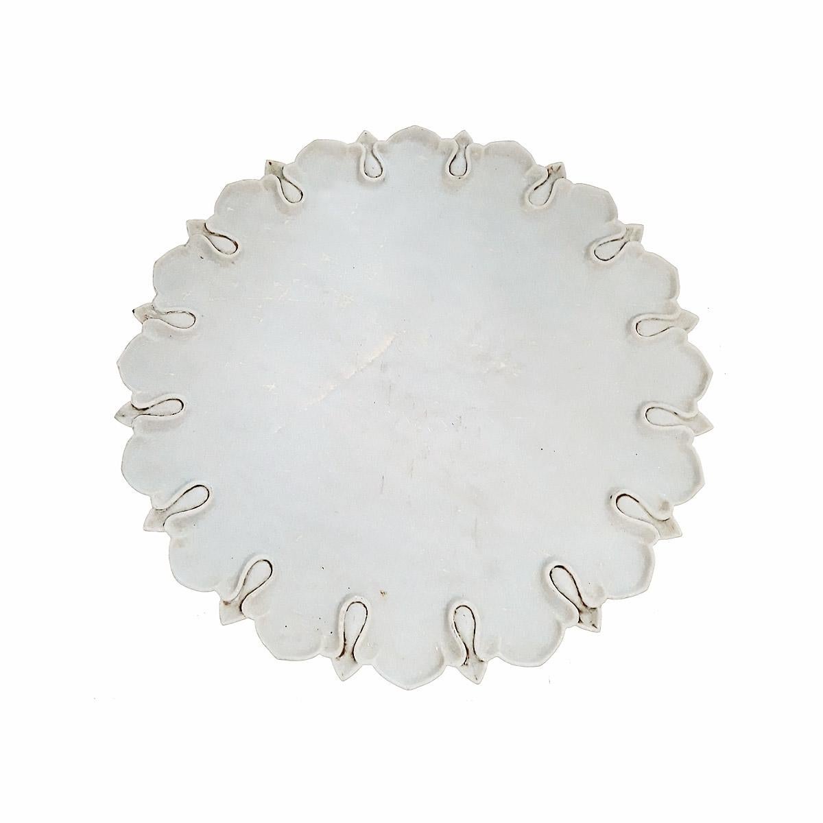 A hand-carved marble charger from India, 1960-1970. 18 inches in diameter, half an inch high. Can be used as a charger, centerpiece or serving tray.