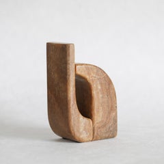 Sujetalibros Darío de mármol tallado a mano por Alexander Lamont