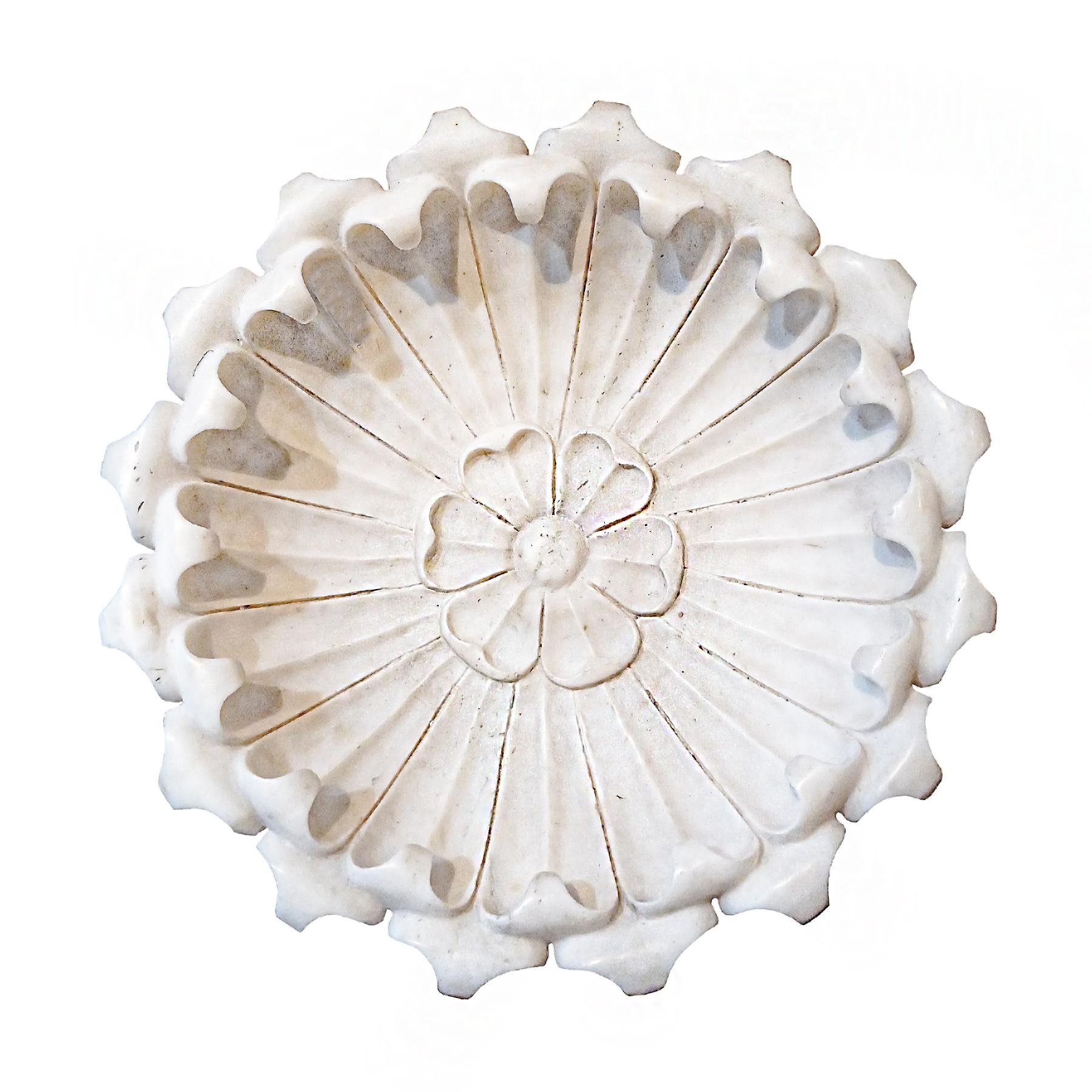 A large, heavy marble bowl, hand-carved with a floral motif. India, circa 1950-1960.

Bone-white colored marble with fine veining.  A massive slab of fine stone turned by expert artisans into a stunning piece, which can be enjoyed indoors or as an