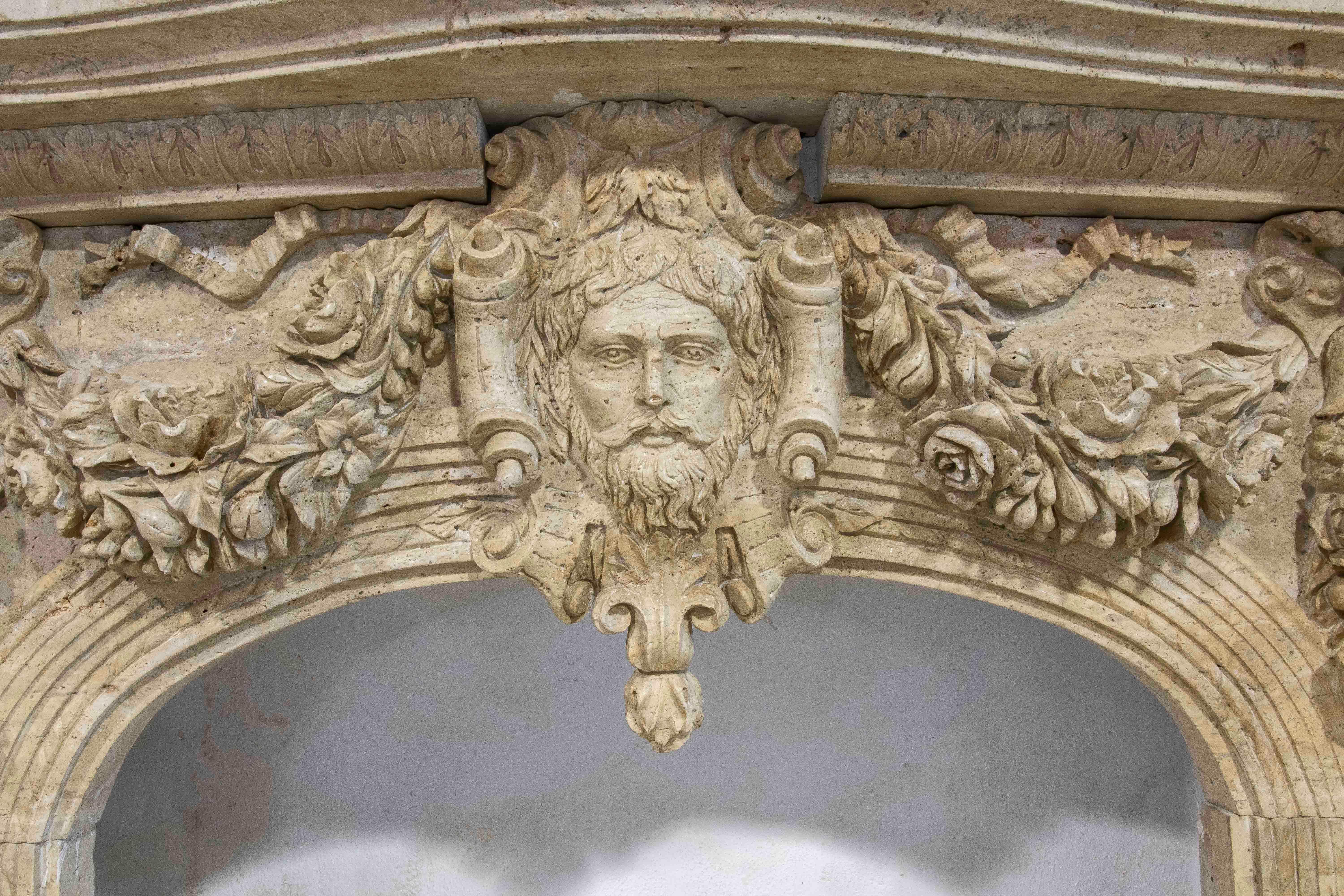 Hand-Carved Hand Carved Marble Monumental Fireplace with Classical Motifs and Lion Masks For Sale