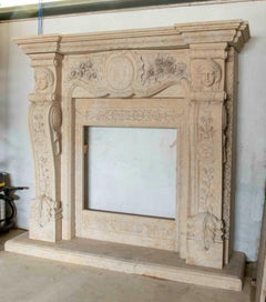 Hand-Carved Marble Monumental Fireplace with Faces and Floral Motifs