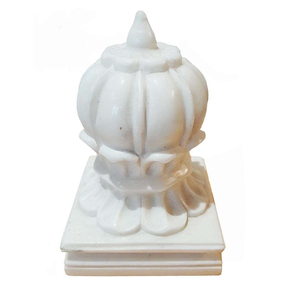 A small carpet weight from India, hand carved in white marble, circa 1980. Can also be used as an elegant paperweight or bookend.