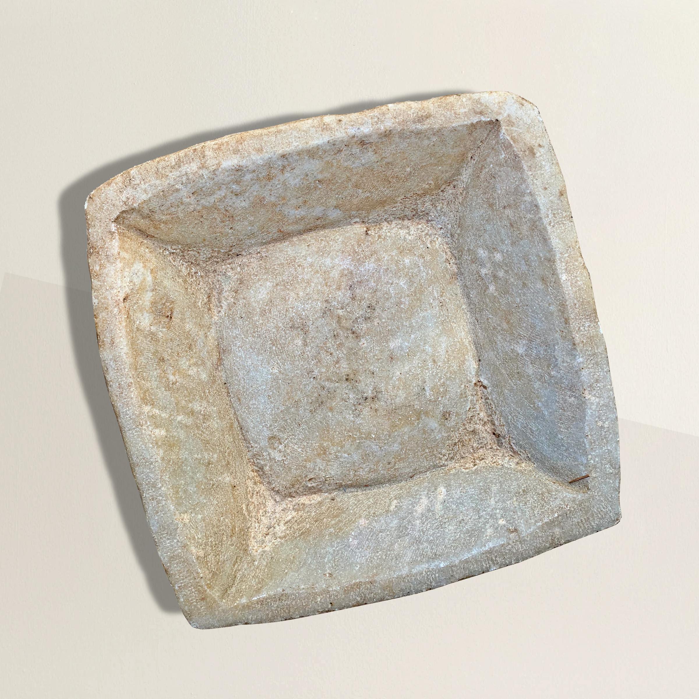 A wonderful 20th century Indian hand-carved marble square dish with slanted sides, perfect for holding your keys or pocket change on a table in your entry, a candle in your bathroom, or your phone next to your bed.