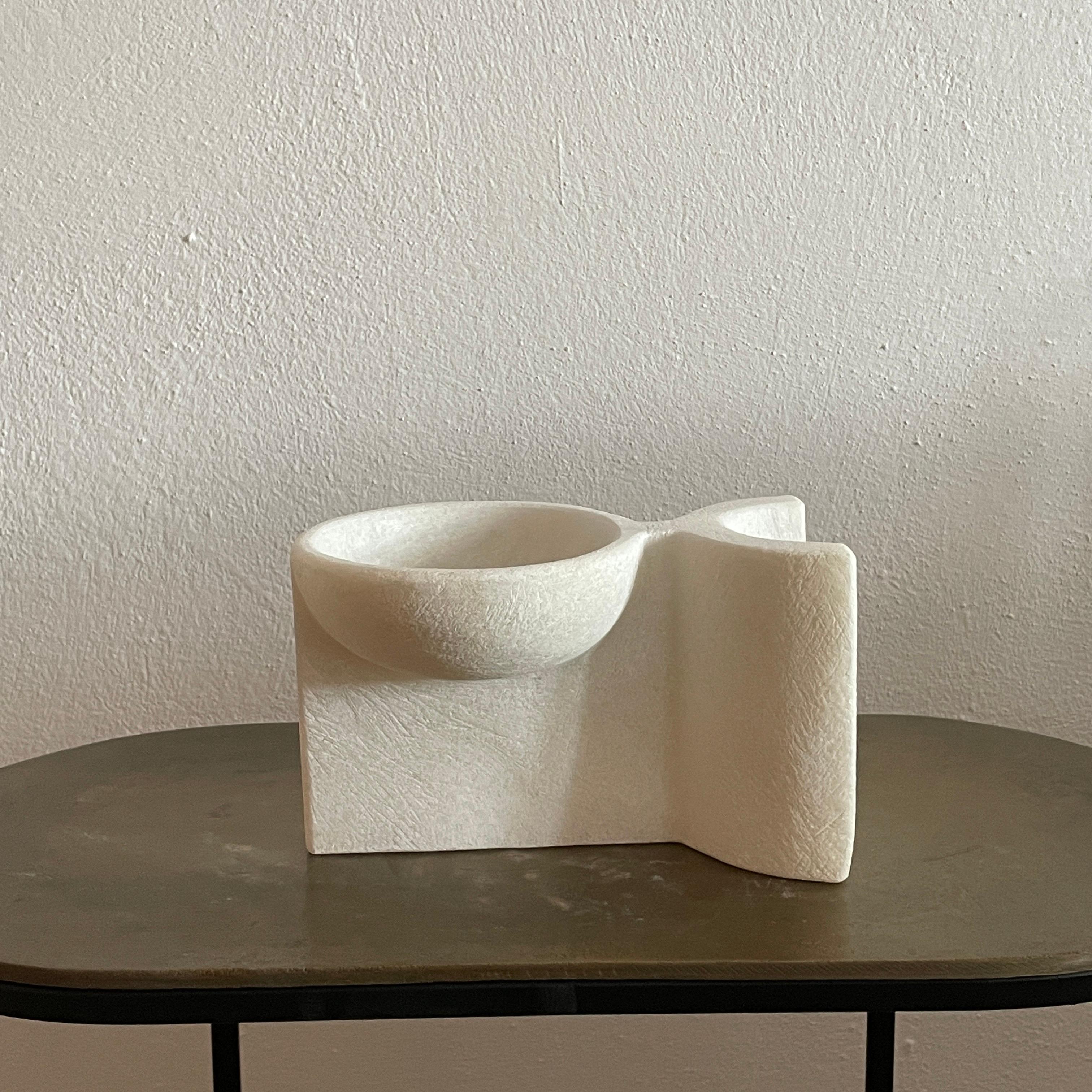 Hand carved marble vessel by Tom Von Kaenel
Materials: Marble
Dimensions: W13 x D20 x H12 cm

Tom von Kaenel, sculptor and painter, was born in Switzerland in 1961. Already in his early
childhood he was deeply devoted to art. His desire to