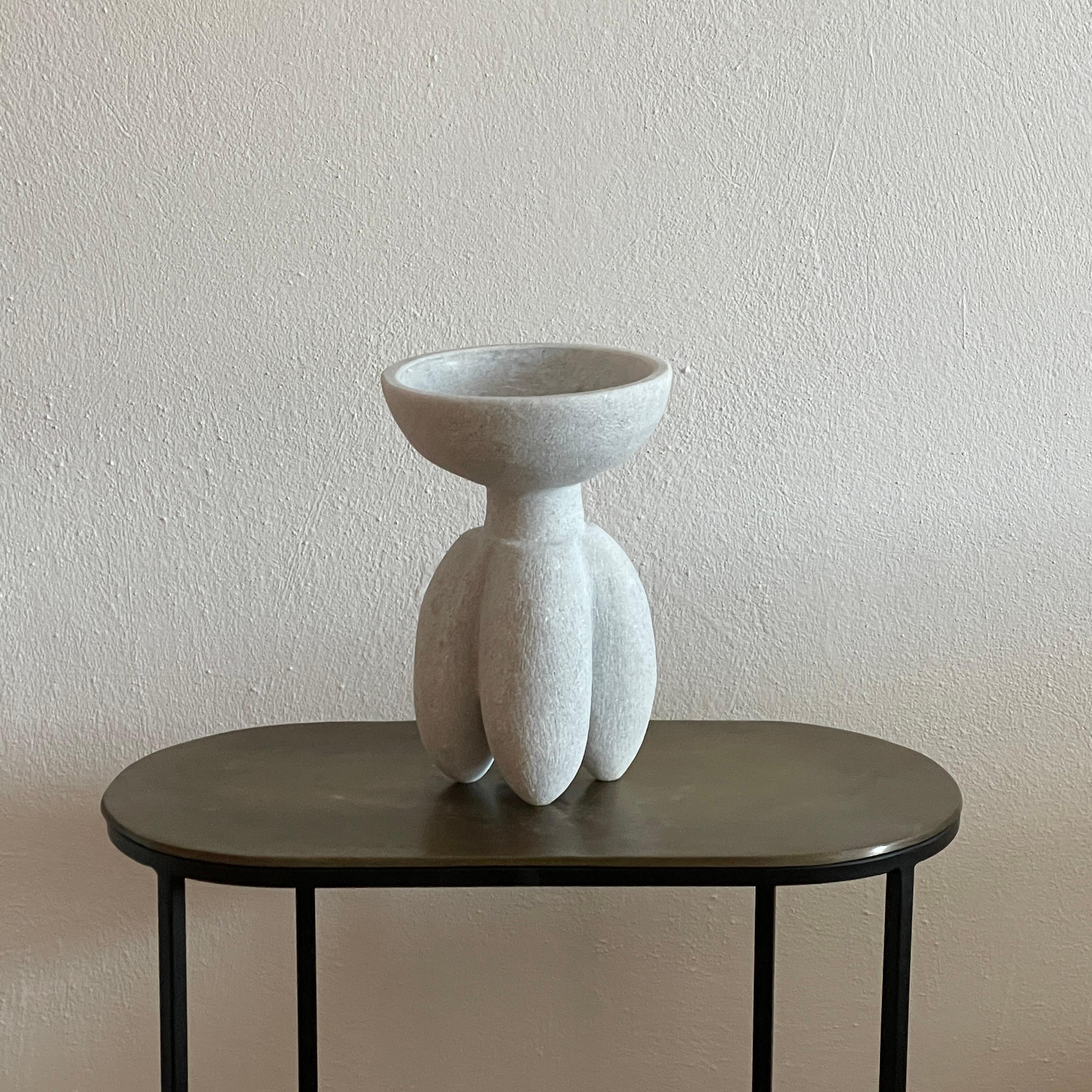 Hand carved marble vessel by Tom Von Kaenel
Materials: marble
Dimensions: W17 x D17 x H28 cm

Tom von Kaenel, sculptor and painter, was born in Switzerland in 1961. Already in his early
childhood he was deeply devoted to art. His desire to
