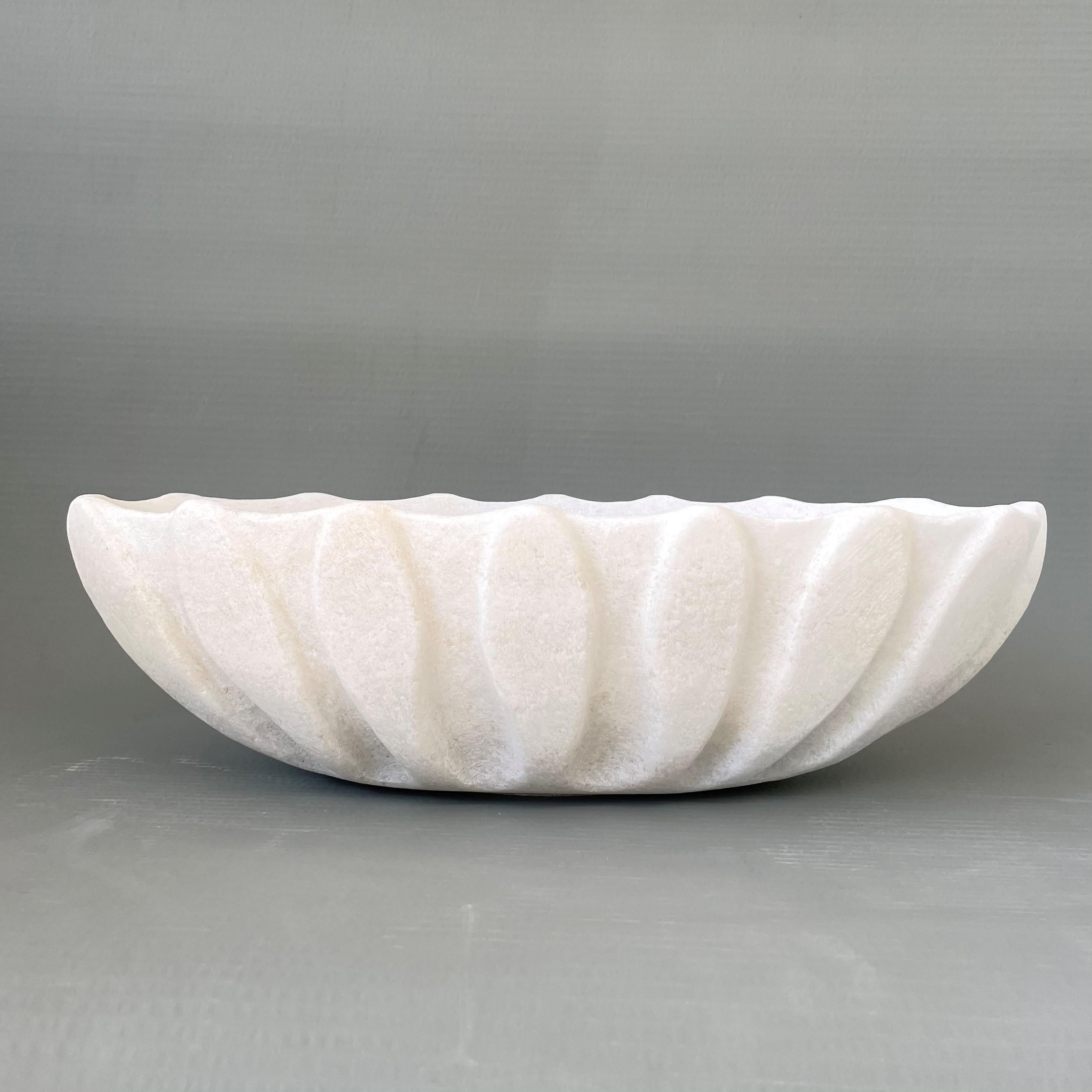 Hand carved marble vessel by Tom Von Kaenel
Dimensions: D45 x W21 x H13 cm
Materials: Marble

Tom von Kaenel, sculptor and painter, was born in Switzerland in 1961. Already in his early childhood he was deeply devoted to art. His desire to bring